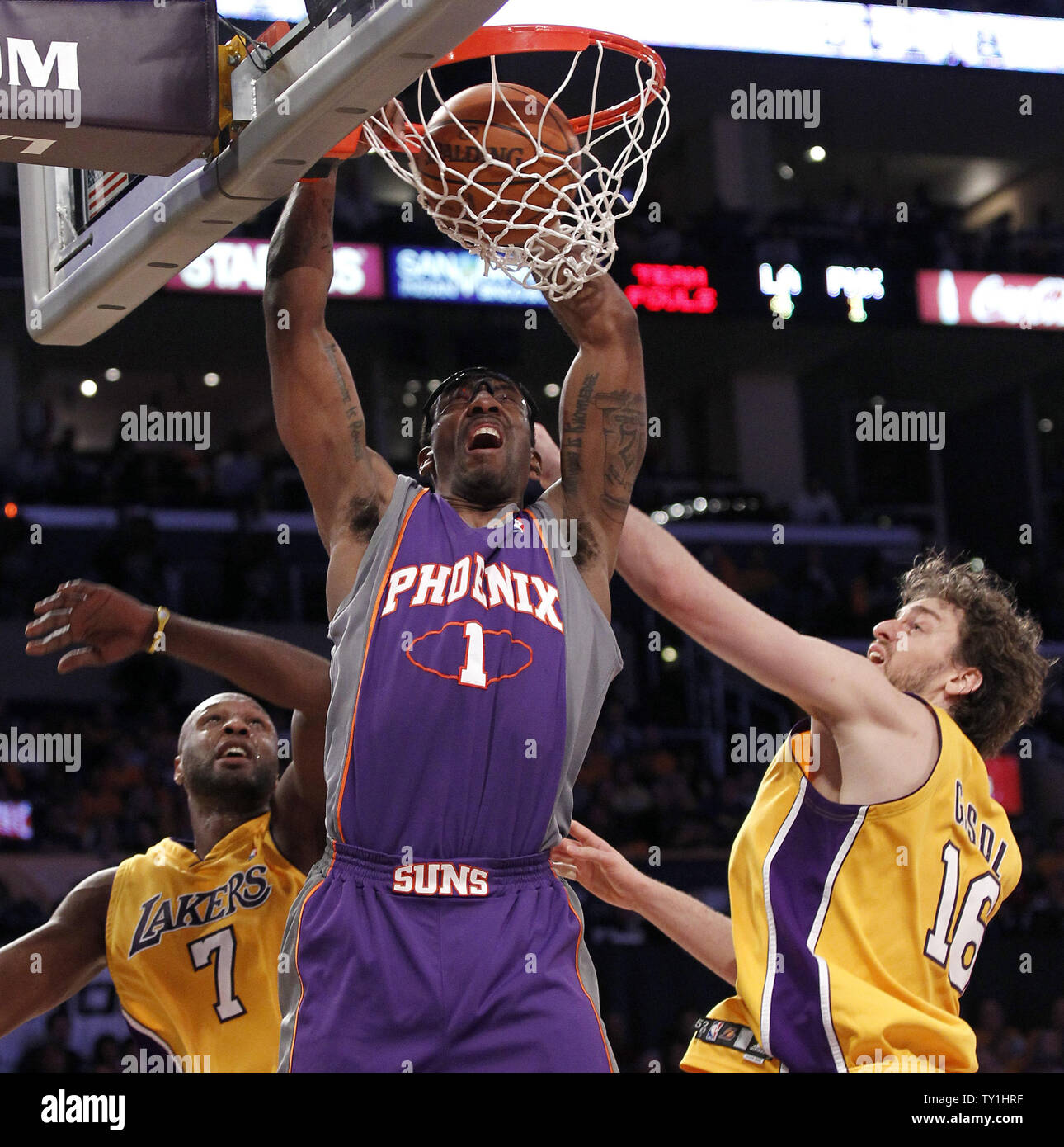 Phoenix Suns forward Amare Stoudemire (1) dunks over Los Angeles Lakers forward Lamar Odom, left, and Pau Gasol, right,  during the first half of Game 1 of their Western Conference Finals series at Staples Center in Los Angeles on May 17, 2010. The Lakers won 128-107 . UPI Photo/Lori Shepler Stock Photo