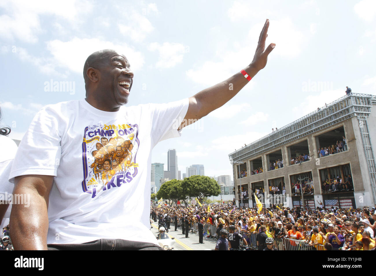Magic Johnson waves to fans as the Los Angeles Lakers celebrate their NBA championship with a parade in Los Angeles on June 21, 2010. The Lakers defeated Celtics to win the championship .
