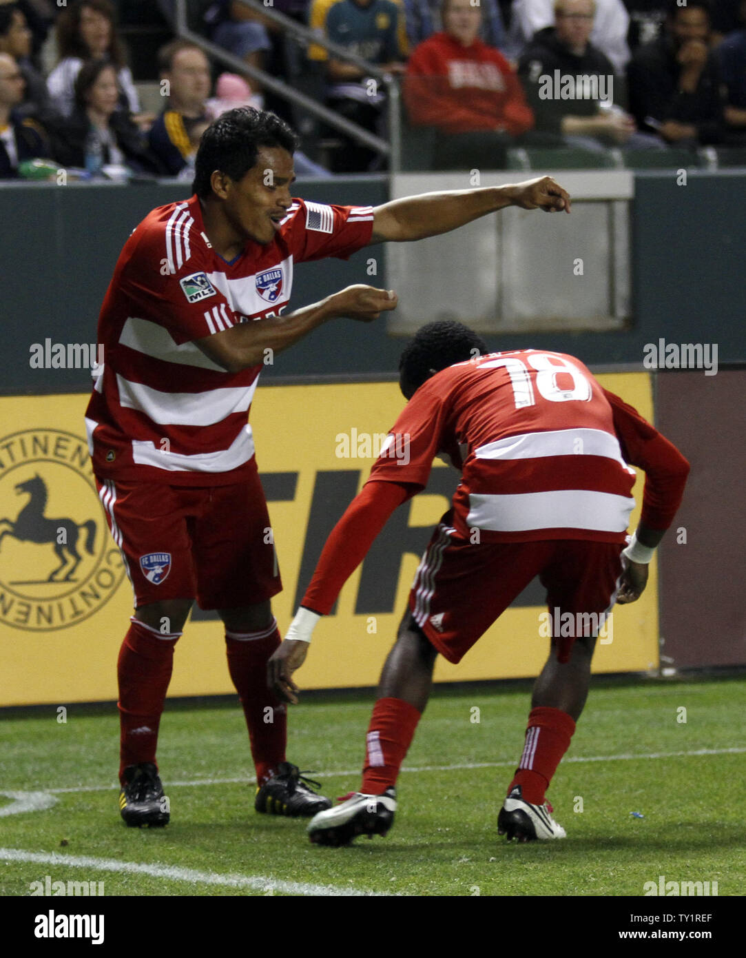 FC Dallas midfielder/forward David Ferreira, left, and  FC Dallas midfielder Marvin Chavez (18)  celebrate after Ferreira scored a goal in the Western Conference Fiinal playoff game at the Home Depot Center in Carson, California on Nov. 14, 2010.    UPI/Lori Shepler. Stock Photo