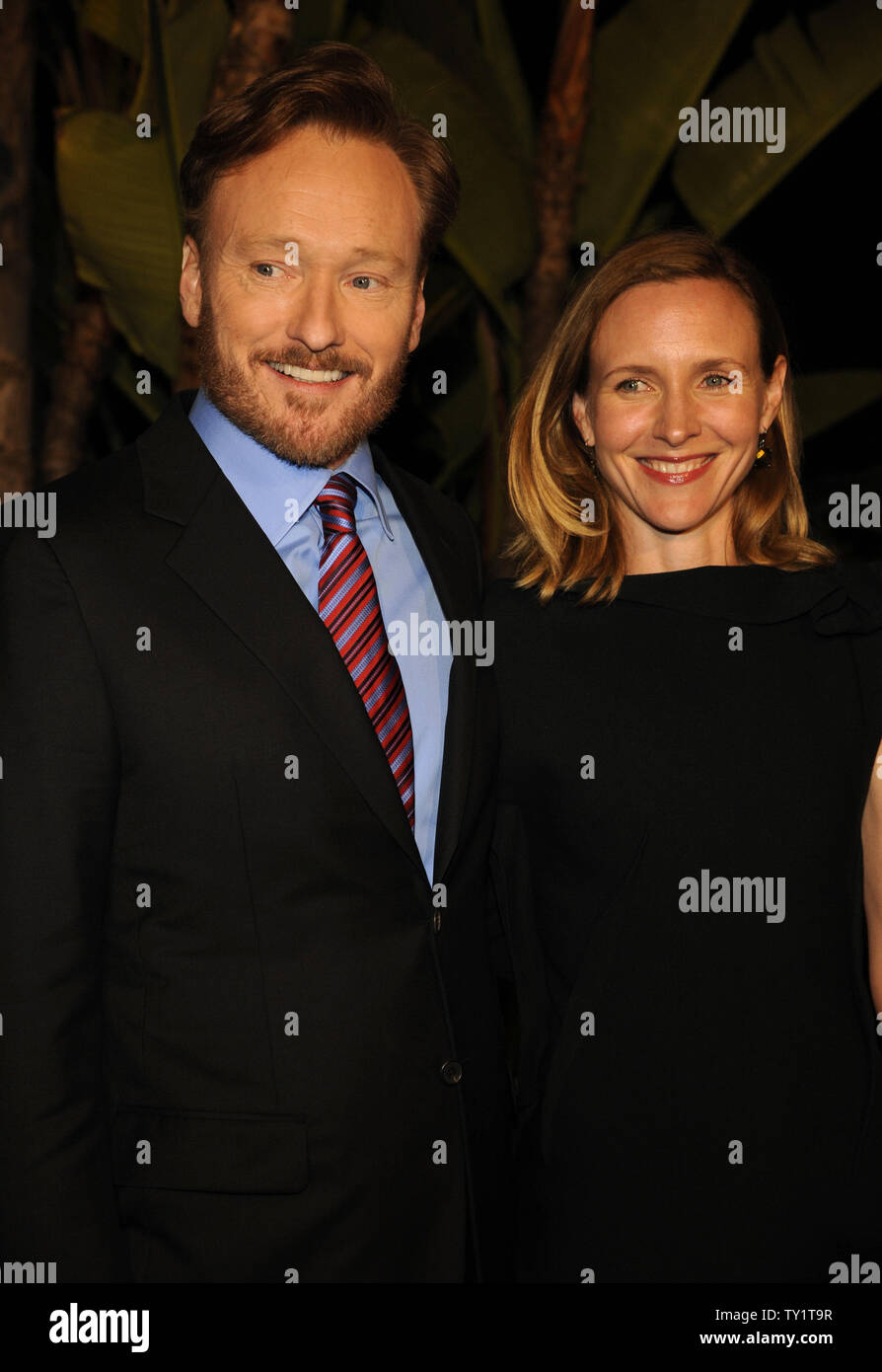 Comedian Conan OBrien (L) And Wife Liza Powel (R)attend The Childrens