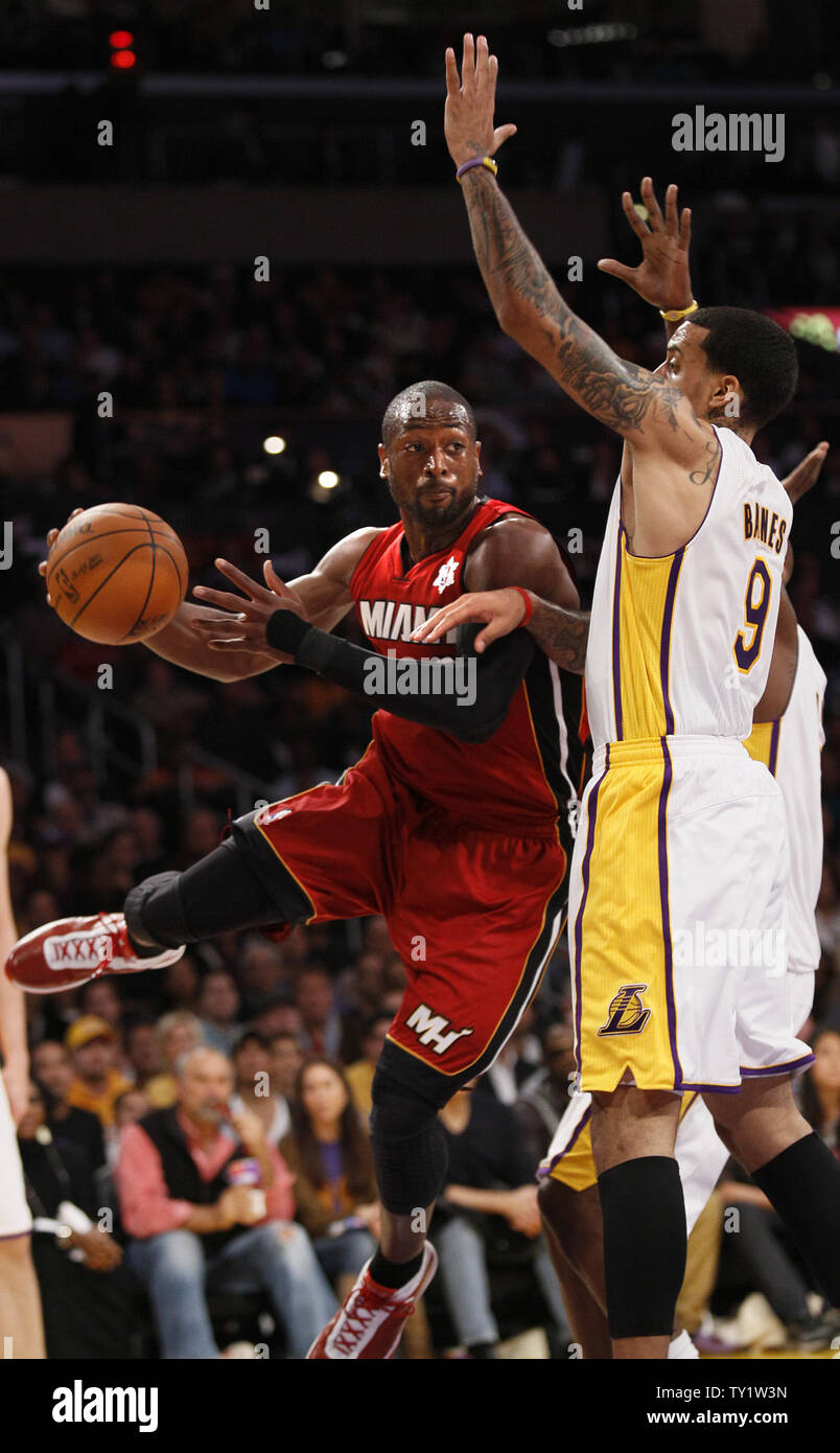 Miami Heat shooting guard Dwyane Wade (3) passes the ball over Los Angeles Lakers small forward Matt Barnes (9) in the first half of  their NBA basketball game in Los Angeles on December  25, 2010.   UPI/Lori Shepler Stock Photo