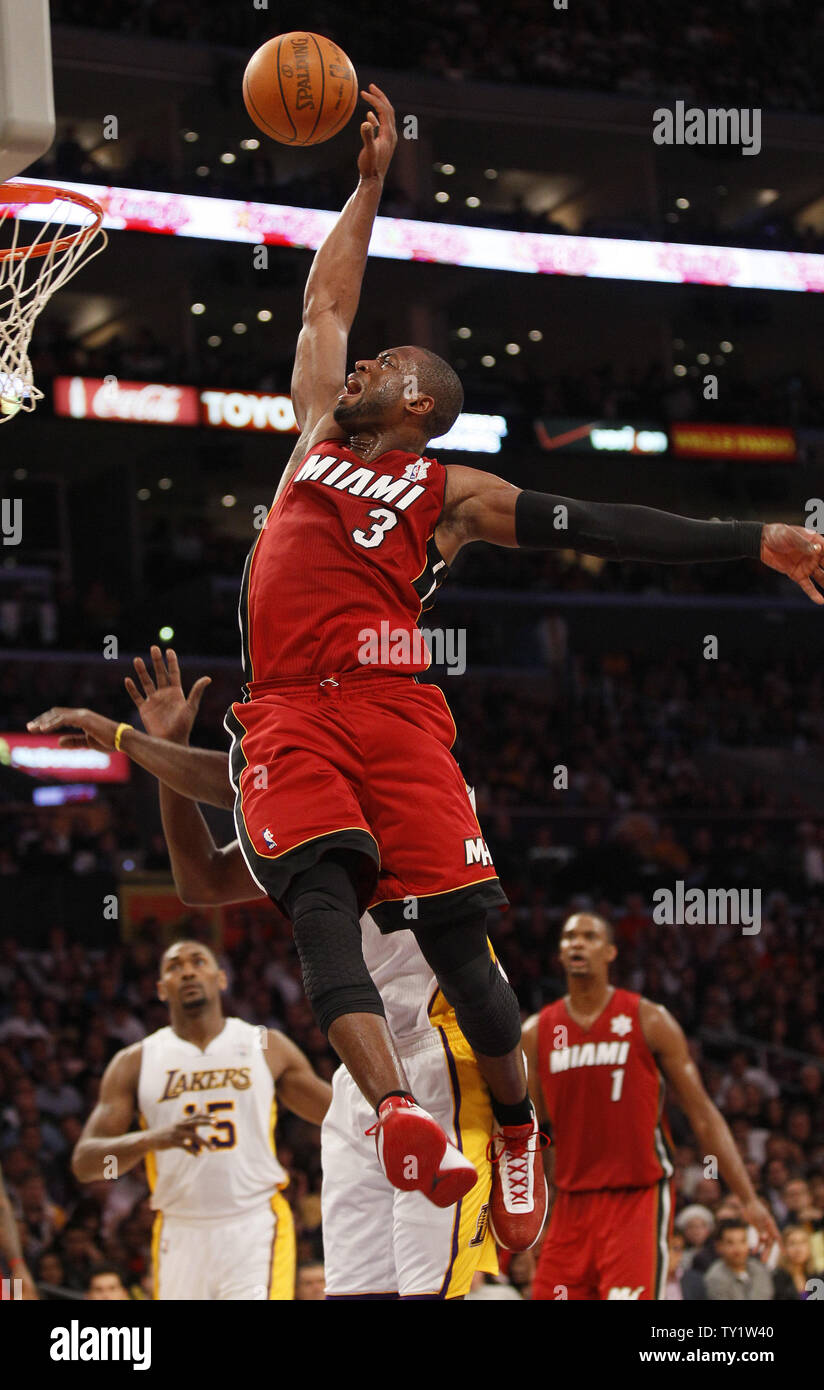 Miami Heat shooting guard Dwyane Wade (3) dunks over the Los Angeles Lakers in the first half of  their NBA basketball game in Los Angeles on December  25, 2010.   UPI/Lori Shepler Stock Photo