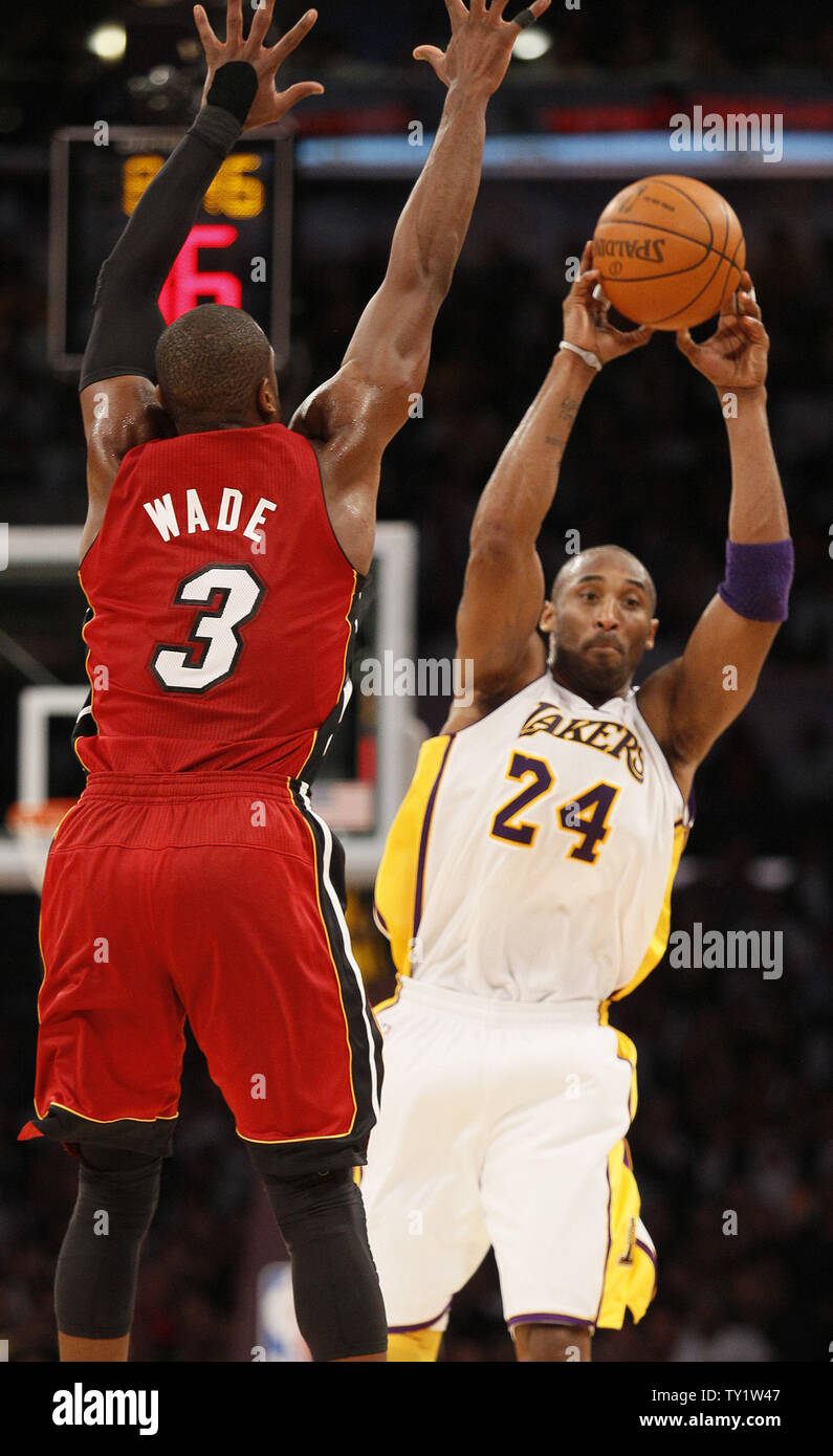 Los Angeles Lakers shooting guard Kobe Bryant (24) passes the ball over Miami Heat shooting guard Dwyane Wade (3) in the second half of  their NBA basketball game in Los Angeles on December  25, 2010.   UPI/Lori Shepler Stock Photo