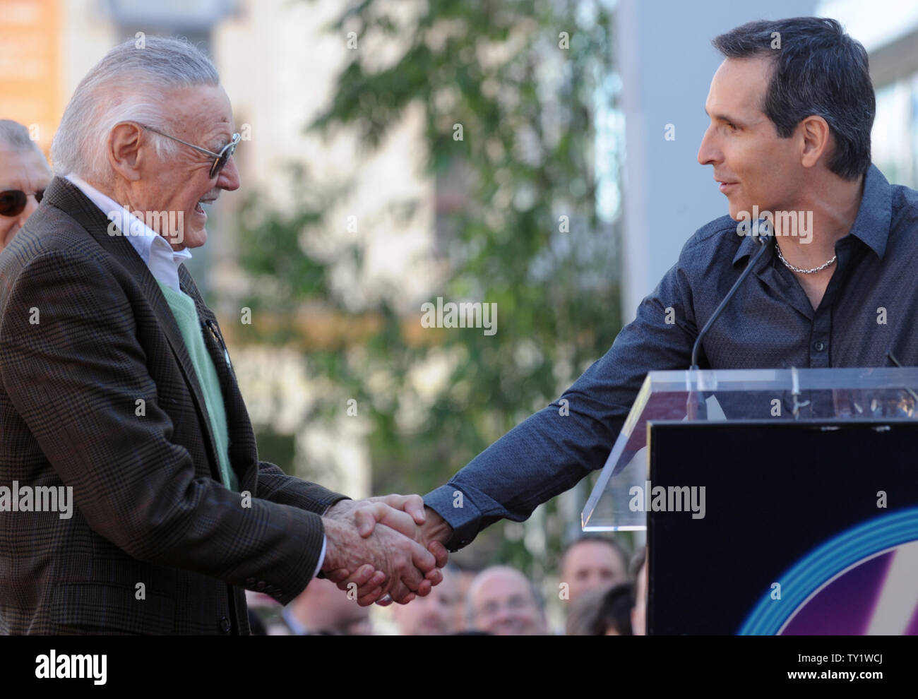 Stan Lee, creator of the Super-Hero comic books 'Spider-Man', 'The Incredible Hulk', 'X-Men', 'Iron Man' and 'The Avengers', Comic book creator Stan Lee (L) gets a handshake from Todd McFarlane, creator of the comic book 'Spawn' and founder of MacFarlane Toys, before Lee received a star on the Hollywood Walk of Fame in Los Angeles January 4, 2011.  UPI/Jim Ruymen Stock Photo