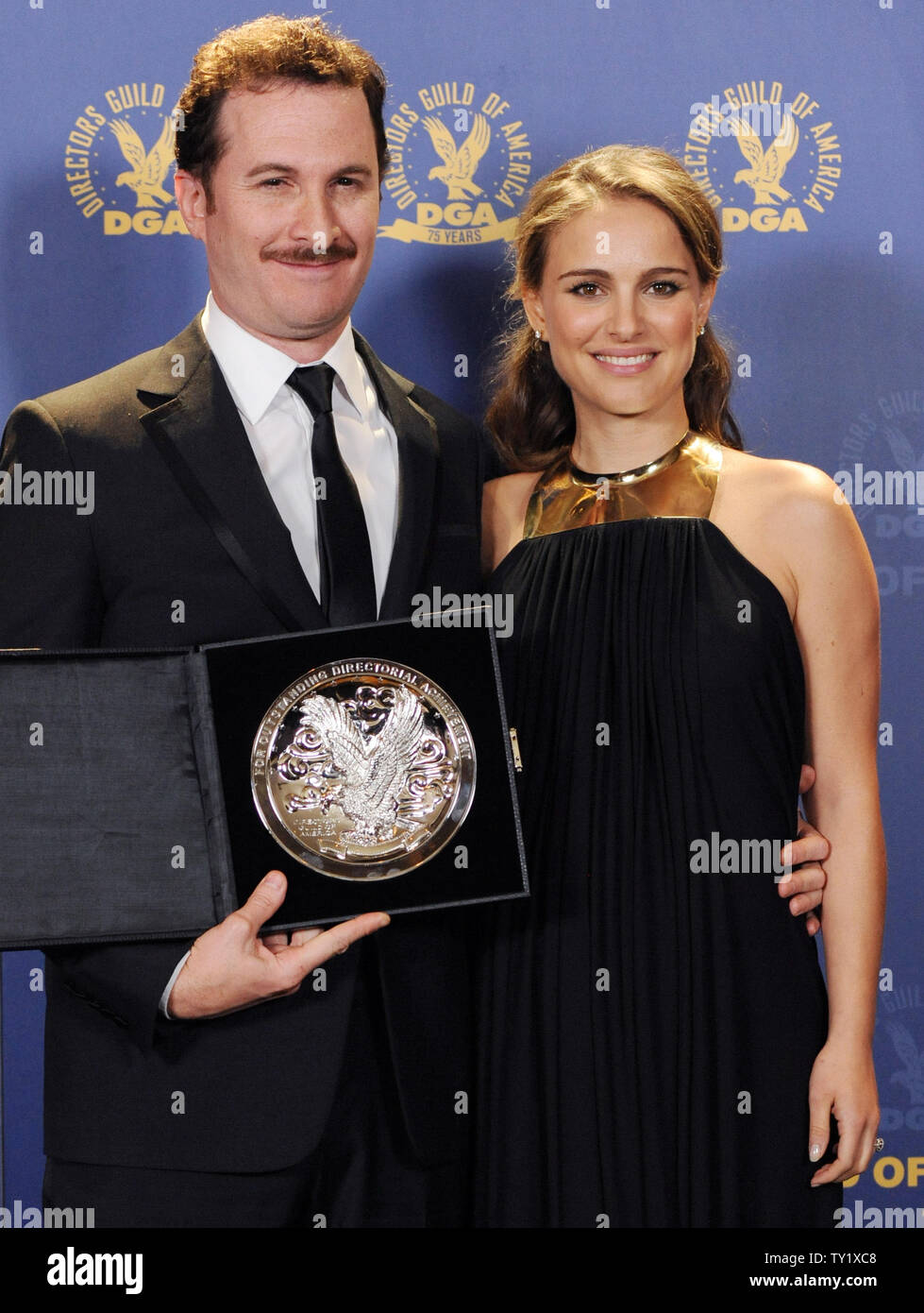 Aronofsky (L), director and feature film award nominee for "Black Swan", appears backstage with cast member Natalie Portman at the 63rd annual Directors Guild of America Awards (DGA) in Los Angeles