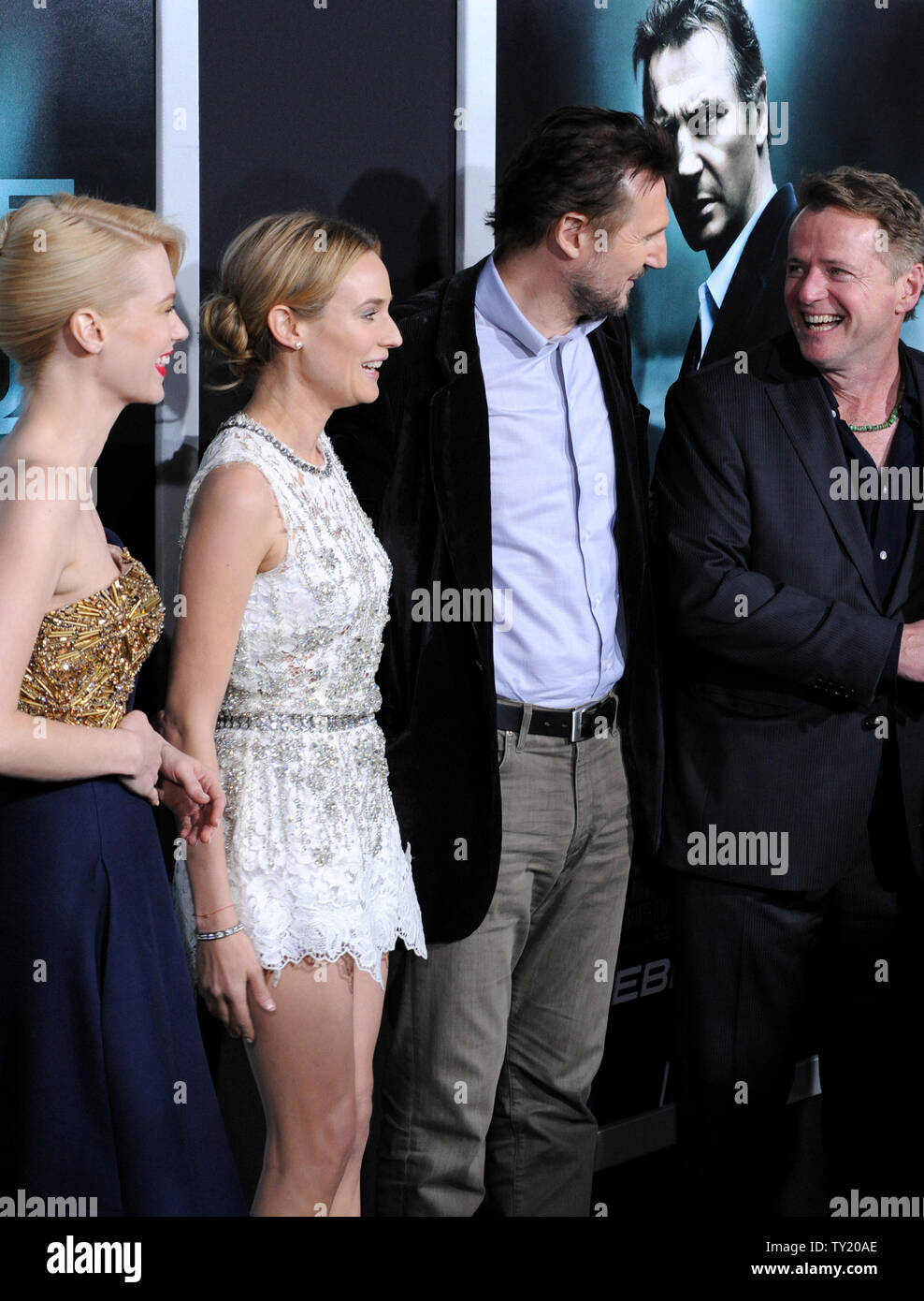January Jones, Liam Neeson, Diane Kruger and Aidan Quinn (L-R), cast members in the motion picture thriller 'Unknown', share a laugh on the red carpet during the premiere of the film at The Mann Village Theatre in Los Angeles on February 16, 2011.  UPI/Jim Ruymen Stock Photo