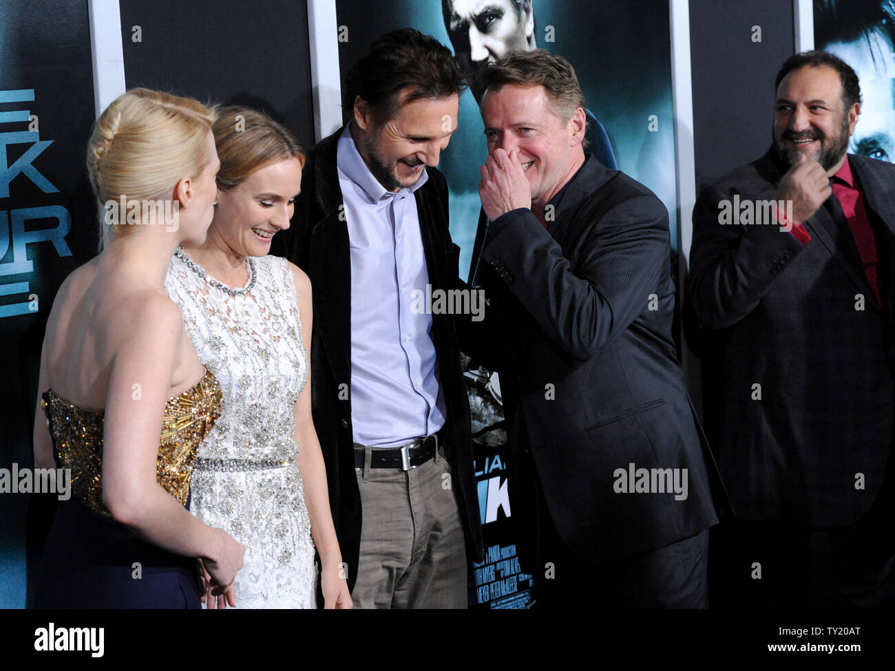 January Jones, Diane Kruger, Liam Neeson and Aidan Quinn (L-R), cast members in the motion picture thriller 'Unknown', share a laugh on the red carpet as producer Joel Sil;ver (R) looks on during the premiere of the film at The Mann Village Theatre in Los Angeles on February 16, 2011.  UPI/Jim Ruymen Stock Photo