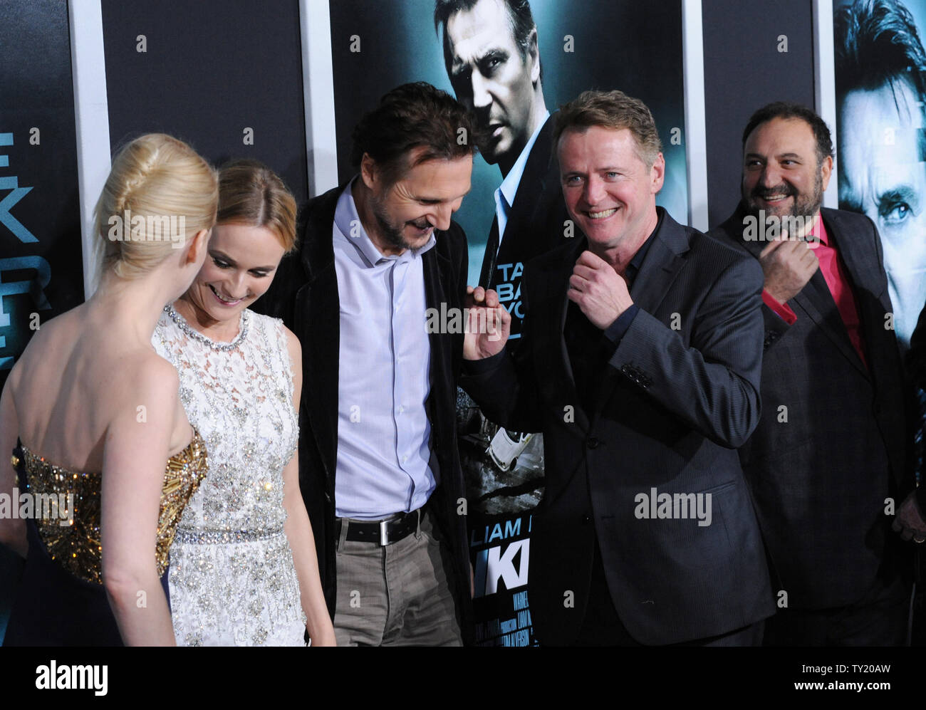January Jones, Diane Kruger, Liam Neeson and Aidan Quinn (L-R), cast members in the motion picture thriller 'Unknown', share a laugh on the red carpet as producer Joel Sil;ver (R) looks on during the premiere of the film at The Mann Village Theatre in Los Angeles on February 16, 2011.  UPI/Jim Ruymen Stock Photo