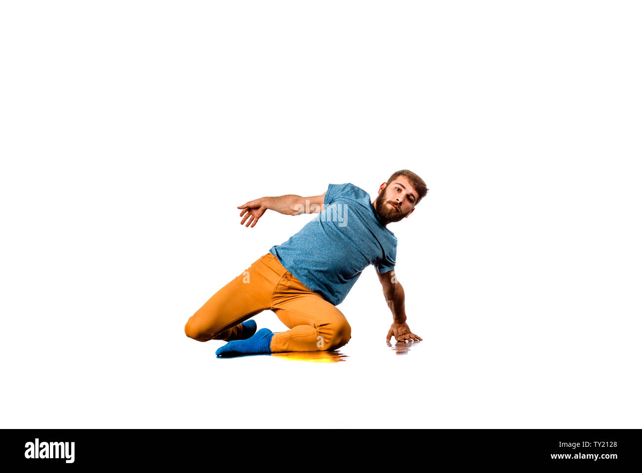 Amazing dancer is doing breakdance on a white background Stock Photo