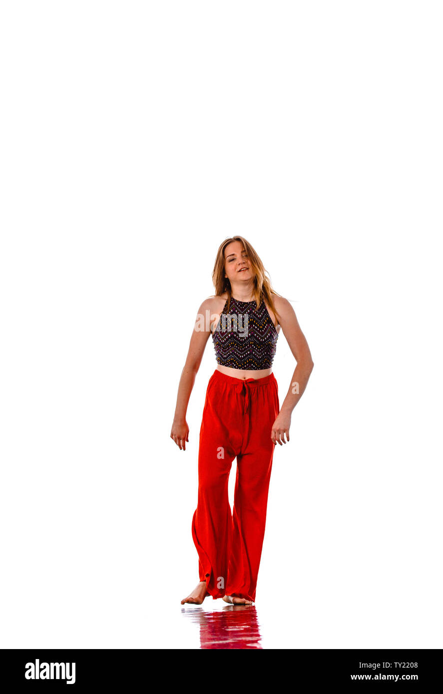 Female zumba instructor doing dancing exercises in sport club Stock Photo