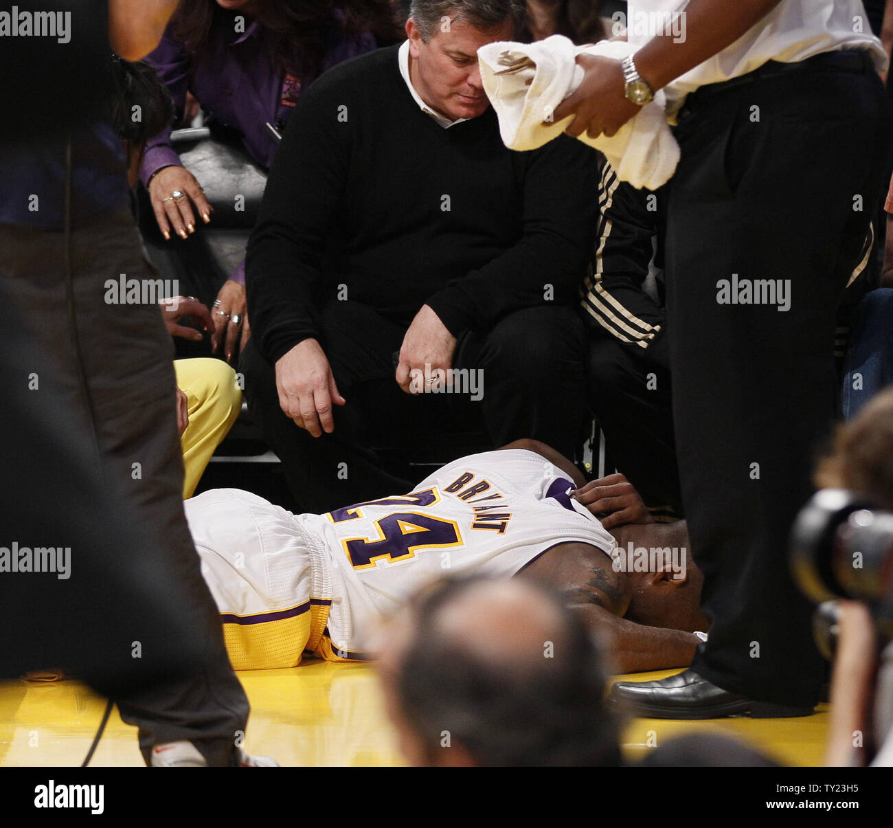 Los Angeles Lakers shooting guard Kobe Bryant (24) lays on the court after hitting his head on a chair against the New Orleans Hornets  during the first half of Game 1 of their Western Conference Playoff series at Staples Center in Los Angeles on April 17, 2011. The Hornets defeated the Lakers 109 to 100  . UPI Photo/Lori Shepler Stock Photo