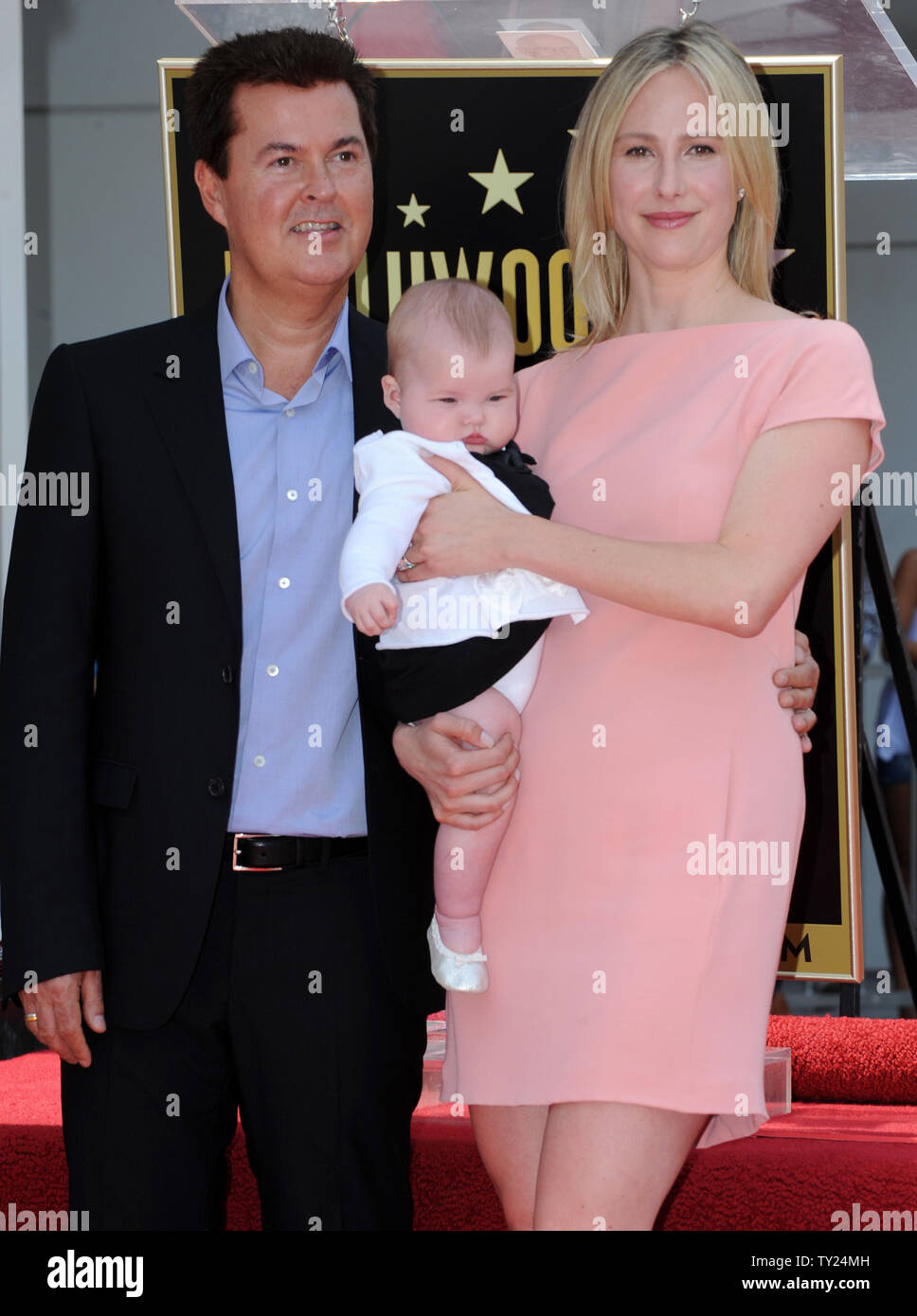 Entertainment producer and creator of 'American Idol' Simon Fuller poses with his wife Natalie Swanston and their son during an unveiling ceremony honoring him with the 2,441st star on the Hollywood Walk of Fame in Los Angeles on May 23, 2011.   UPI/Jim Ruymen Stock Photo