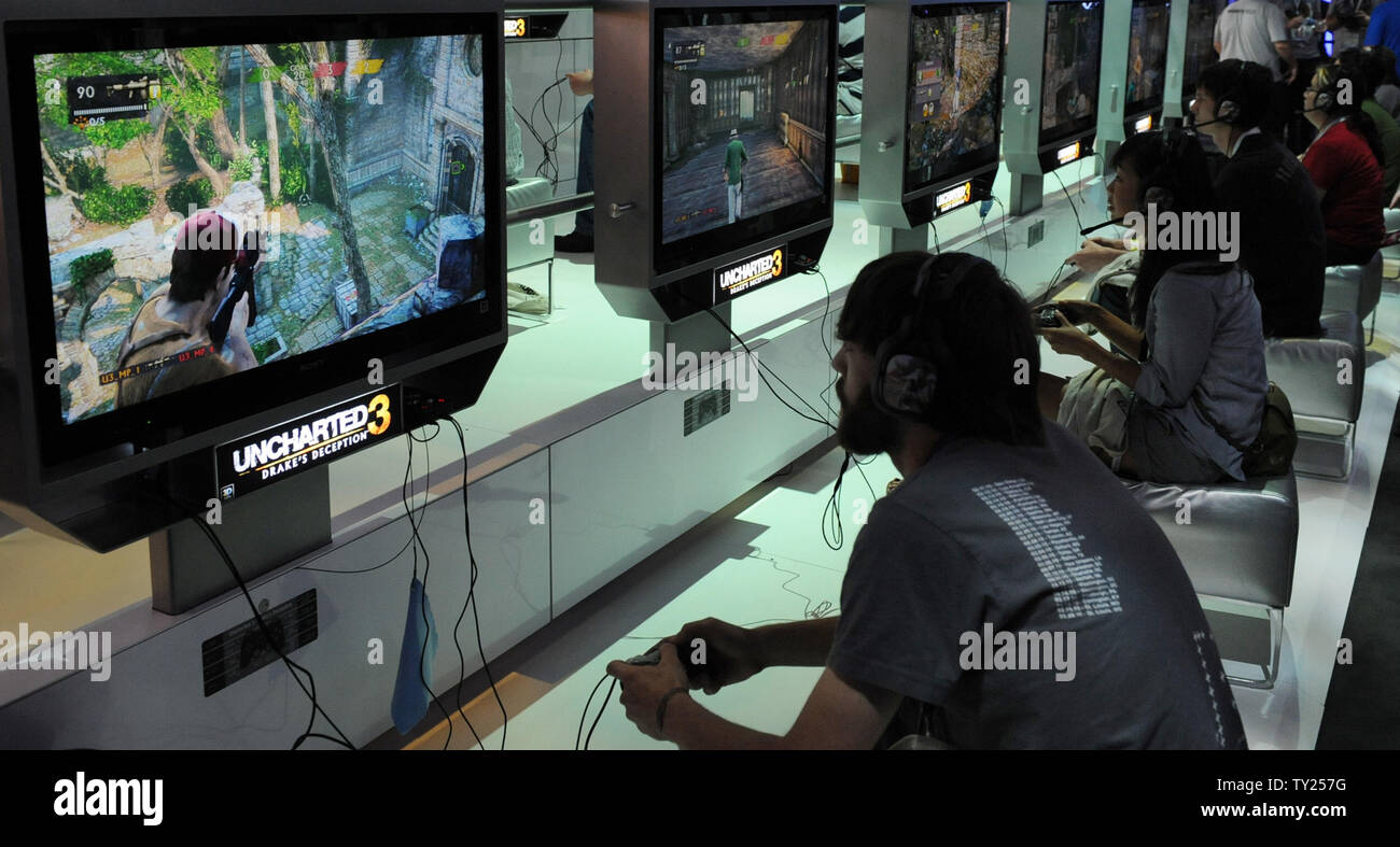 Gamers play video games at the E3 Electronic Entertainment Expo in Los  Angeles on June 7, 2011. More than 45,000 people are expected to attend the  annual three-day E3 Electronic Entertainment Expo