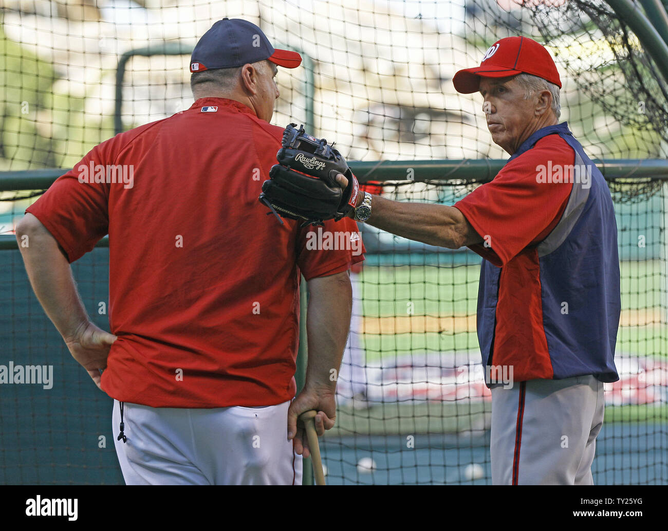 Los Angeles Angels manager Mike Scioscia walks back to the dugout after  arguing unsucessfully on a dropped-third-strike in the ninth inning of Game  2 of the American League Championship Series against the