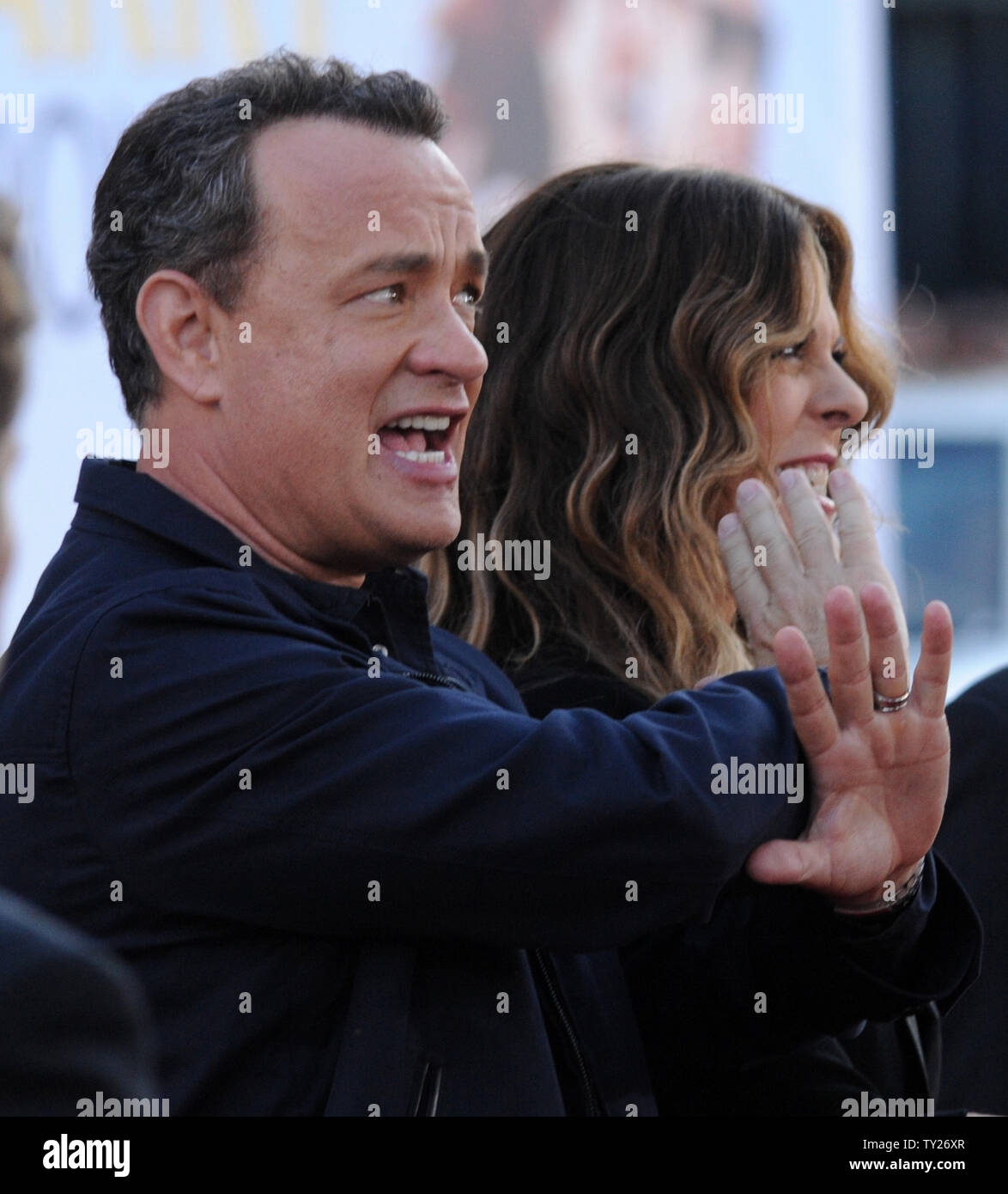 Director/writer/producer/actor Tom Hanks and his wife and cast member Rita  Wilson arrive for the premiere of the motion picture romantic comedy drama  "Larry Crowne", at Grauman's Chinese Theatre in the Hollywood section