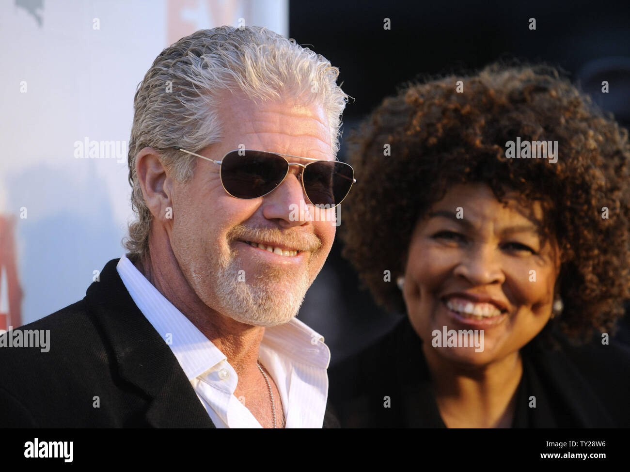 Cast member Ron Perlman (L) and wife Opal attend the Sons of Anarchy, Season 4 premiere screening at the Arclight Theatre in the Hollywood section of Los Angeles on August 30, 2011.      UPI/Phil McCarten Stock Photo