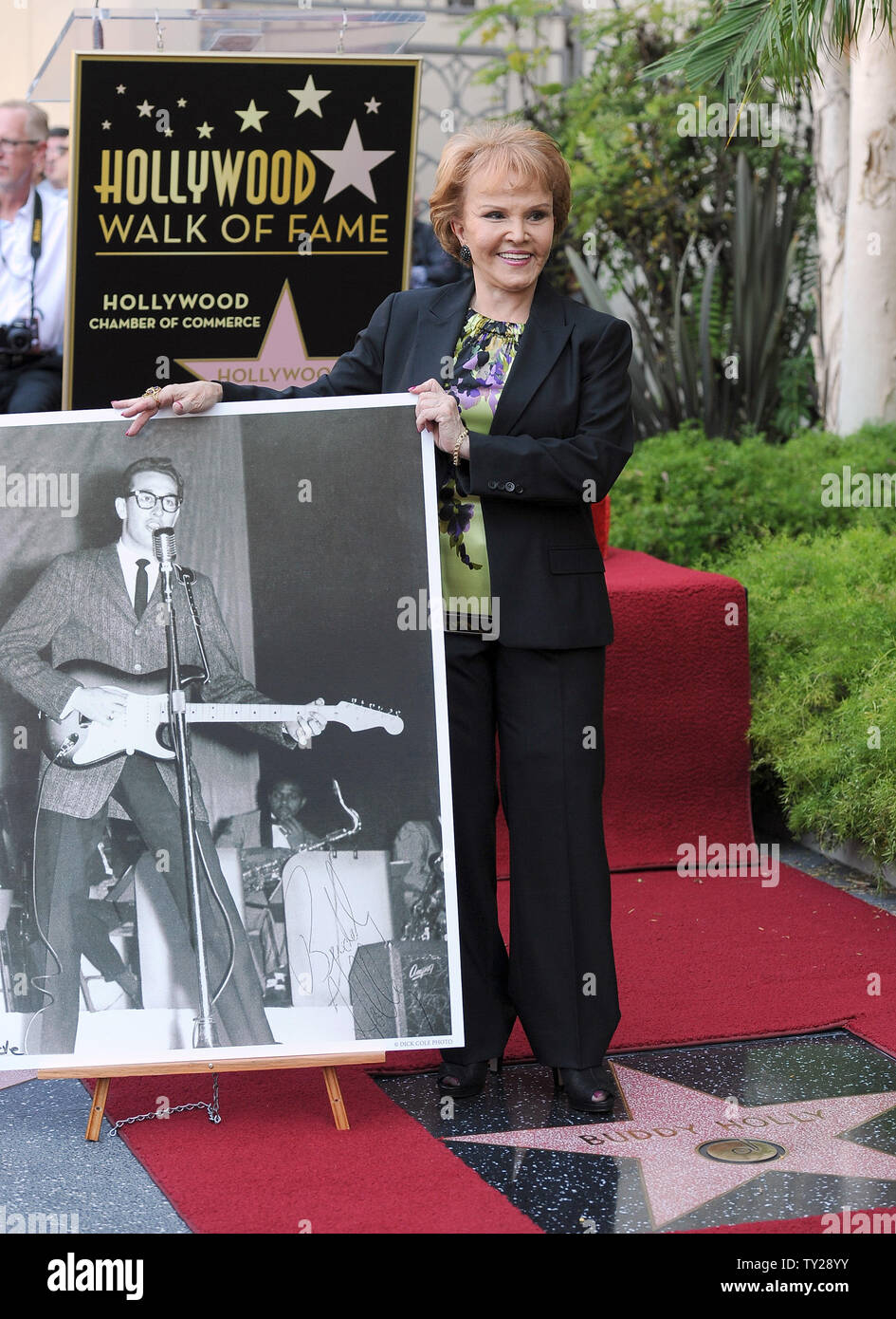 Maria Elena Holly stands near a photo of her late husband next to his star of the Walk of Fame as the late Buddy Holly received a posthumous Walk of Fame Star on his 75th birthday on Vine Street in front of The Capitol Records Building  in Los Angeles on September 7, 2011.  UPI/Jayne Kamin-Oncea Stock Photo