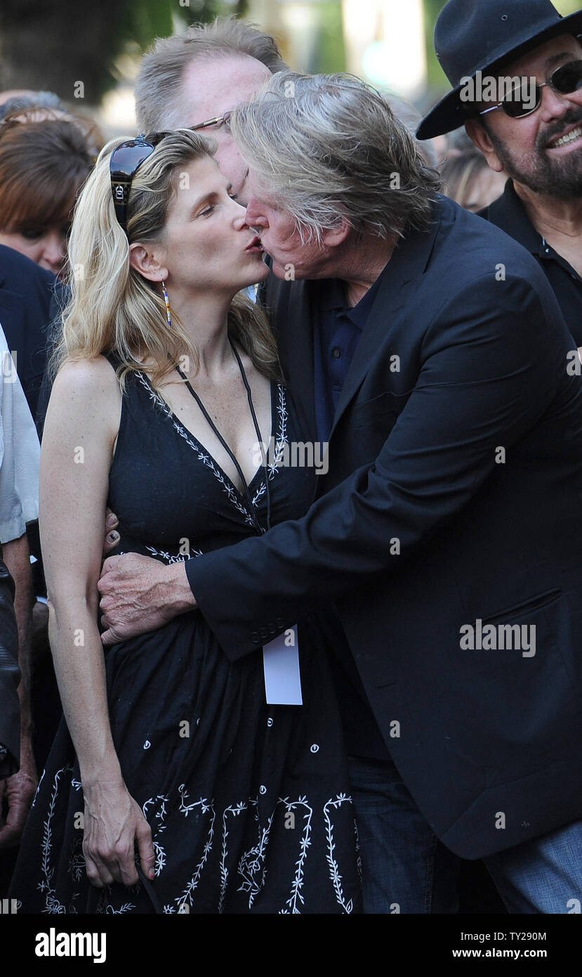 The late Buddy Holly received a posthumous Walk of Fame Star on his 75th birthday on Vine Street in front of The Capitol Records Building in Los Angeles on September 7, 2011.  Stephanie and Gary Busey share a moment during the ceremony .  UPI/Jayne Kamin-Oncea Stock Photo