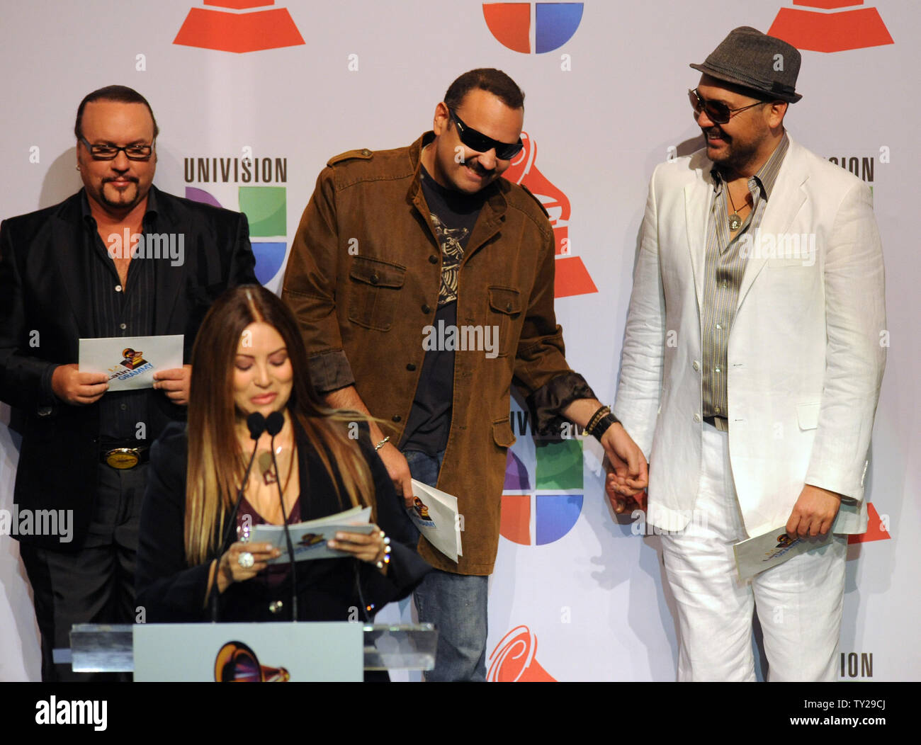 Musicians Pepe Agullar (C) and Reyli share a light moment as singer and songwriter Myriam Hernandez announces nominations for the 12th annual Latin Grammy Awards, during a news conference at the Avalon Theatre in the Hollywood section of Los Angeles on September 14, 2011. The winners will be announced in Las Vegas on November 10.  UPI/Jim Ruymen Stock Photo