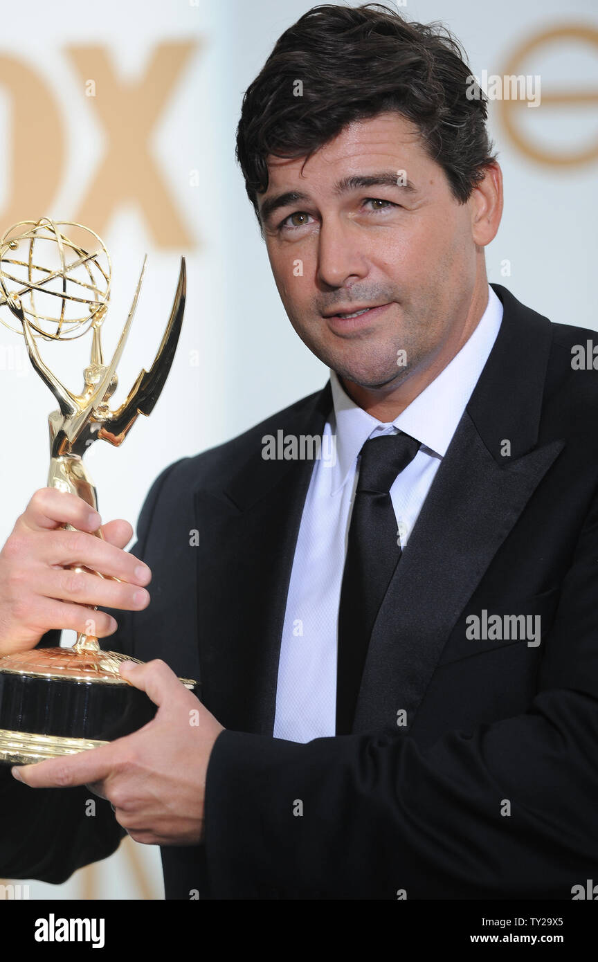 Kyle Chandler holds his Emmy for lead actor award for "Friday Night