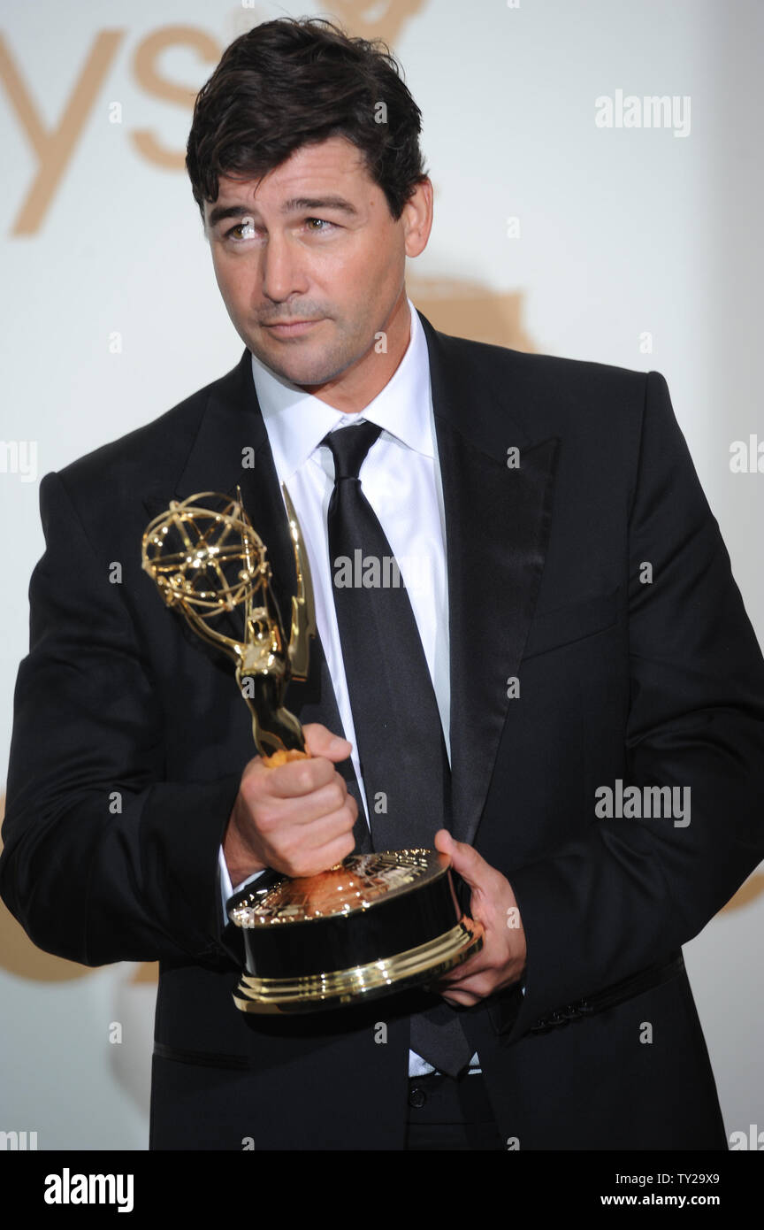 Kyle Chandler holds his Emmy for lead actor award for "Friday Night Lights" at the 63rd