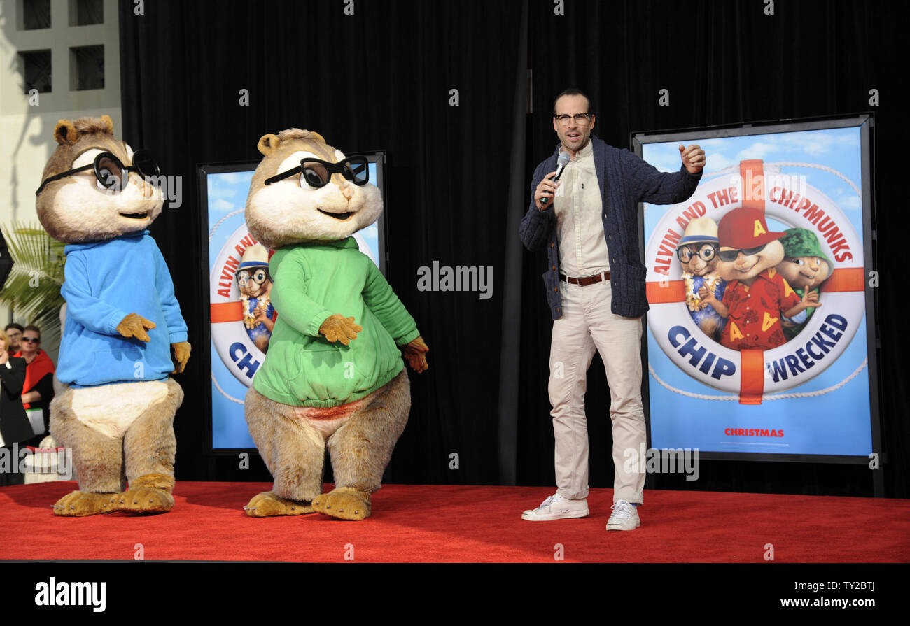 Actor Jason Lee (R) speaks at a ceremony where Alvin and the Chipmunks are honored with a hand & footprint ceremony in the courtyard of Grauman's Chinese Theatre in the Hollywood section of Los Angeles on November 1, 2011.      UPI/Phil McCarten Stock Photo