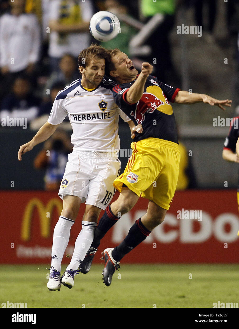 Los Angeles Galaxy forward Mike Magee (18) and New York Red Bulls defender/midfielder Teemu Tainio (2) go for a header in the first half  in the MLS Western Conference Semifinals game at the Home Depot Center in Carson, California on Nov. 3, 2011.    UPI/Lori Shepler. Stock Photo