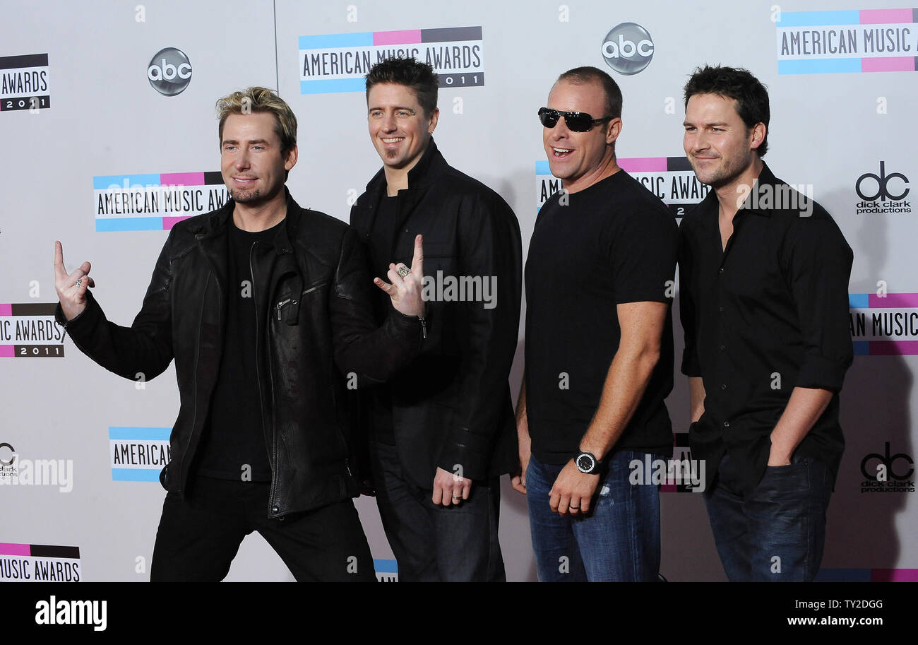 Musicians Chad Kroeger Daniel Adair Mike Kroeger And Ryan Peake Of The Band Nickelback Arrive At The 39th American Music Awards At Nokia Theatre In Los Angeles On November 20 2011 Upi Jim