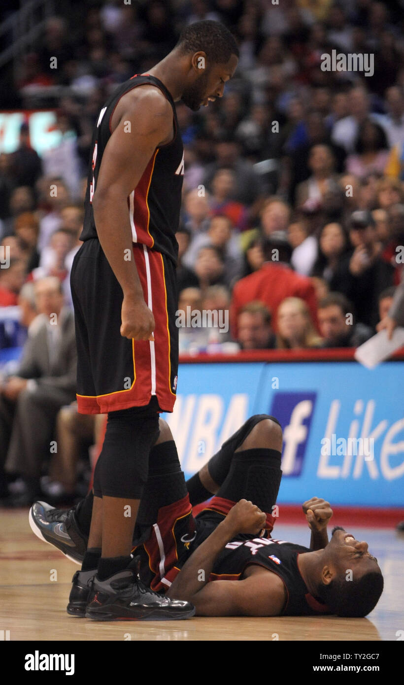 Miami Heat shooting guard Dwyane Wade (3) looks down at Norris Cole (30) after a collision in the second half of  their NBA basketball game against the Los Angeles Clippers in Los Angeles on January 11, 2012.  The Clippers won 95-89.  UPI/Lori Shepler Stock Photo