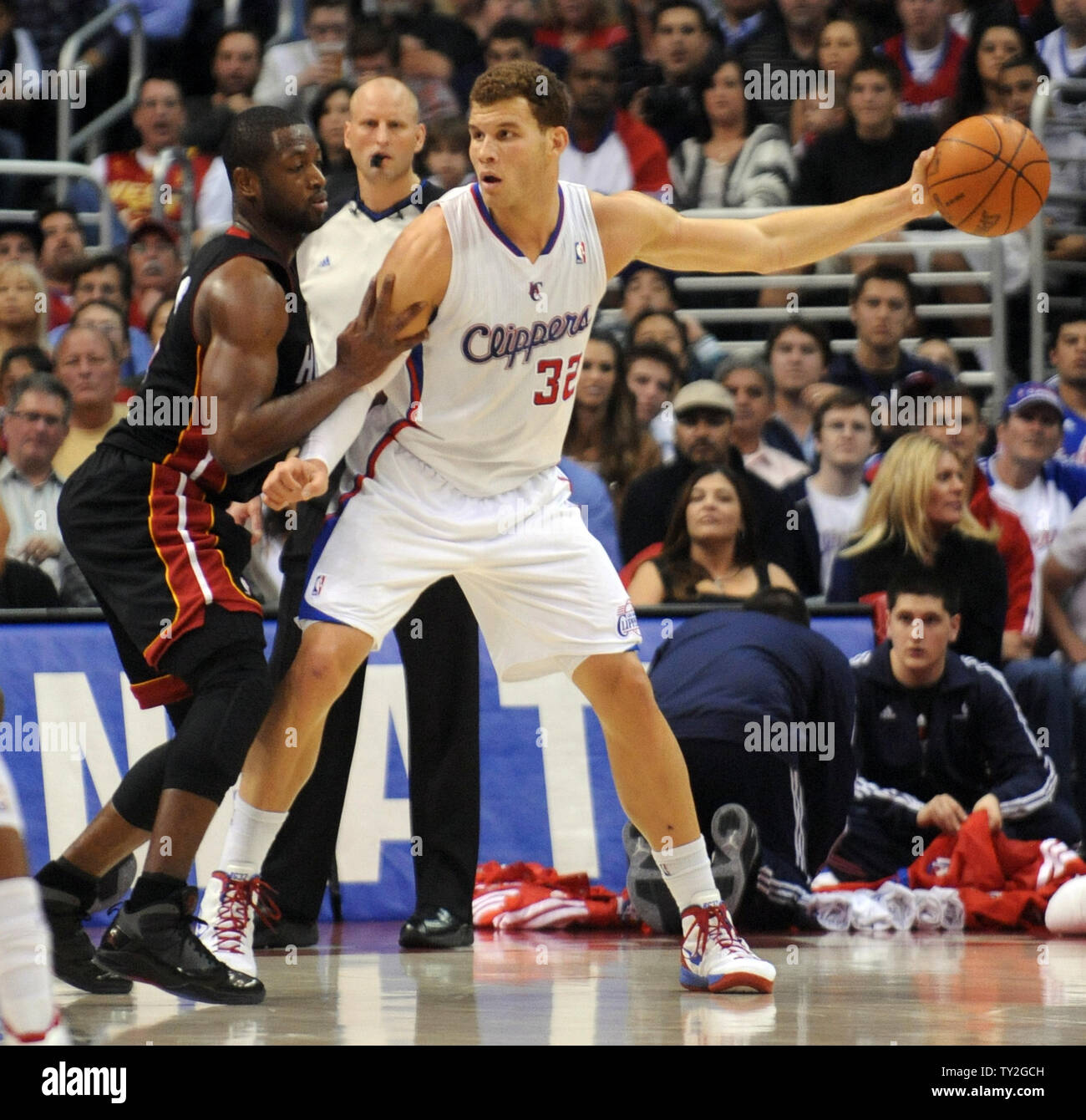 Los Angeles Clippers power forward Blake Griffin (32) keeps the ball away from Miami Heat shooting guard Dwyane Wade (3) in the first half of  their NBA basketball game in Los Angeles on January 11, 2012.    UPI/Lori Shepler Stock Photo