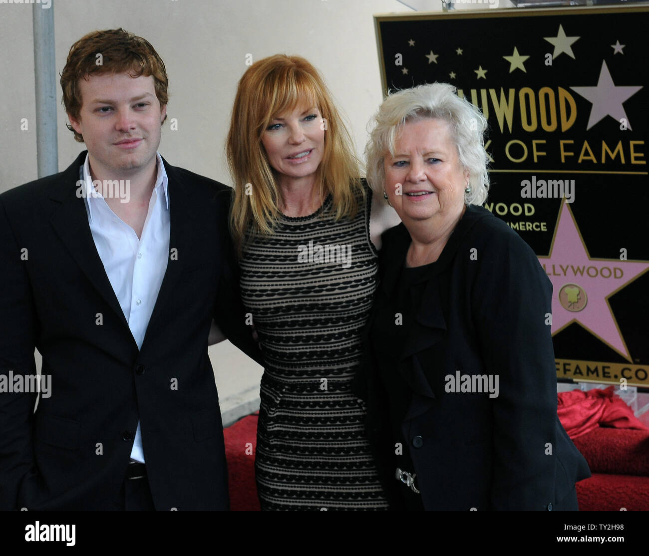 Actress Marg Helgenberger poses with her son Hugh Howard Rosenberg and mother Kay Snyder during an unveiling ceremony honoring her with the 2,458th star on the Hollywood Walk of Fame in Los Angeles on January 23, 2012. UPI/Jim Ruymen Stock Photo