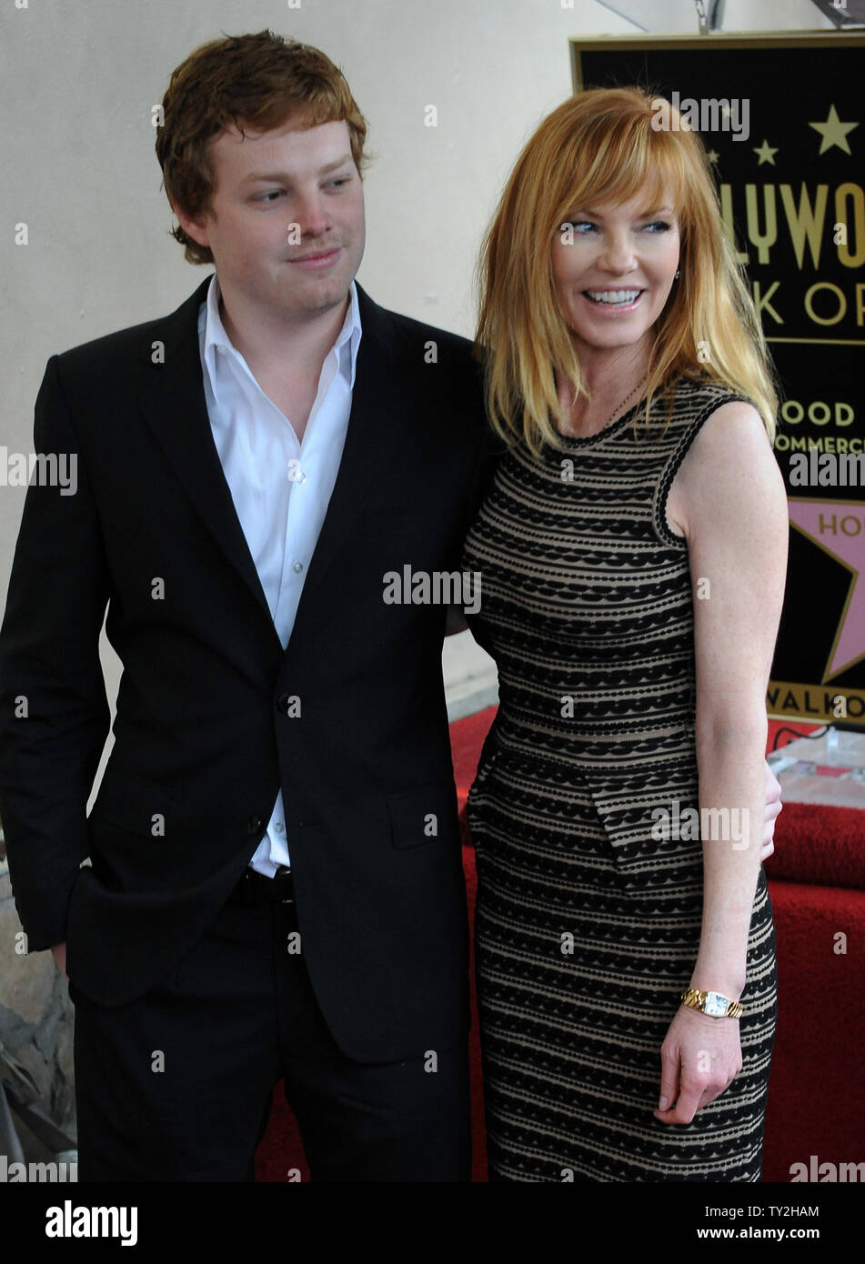 Actress Marg Helgenberger poses with her son Hugh Howard Rosenberg ...