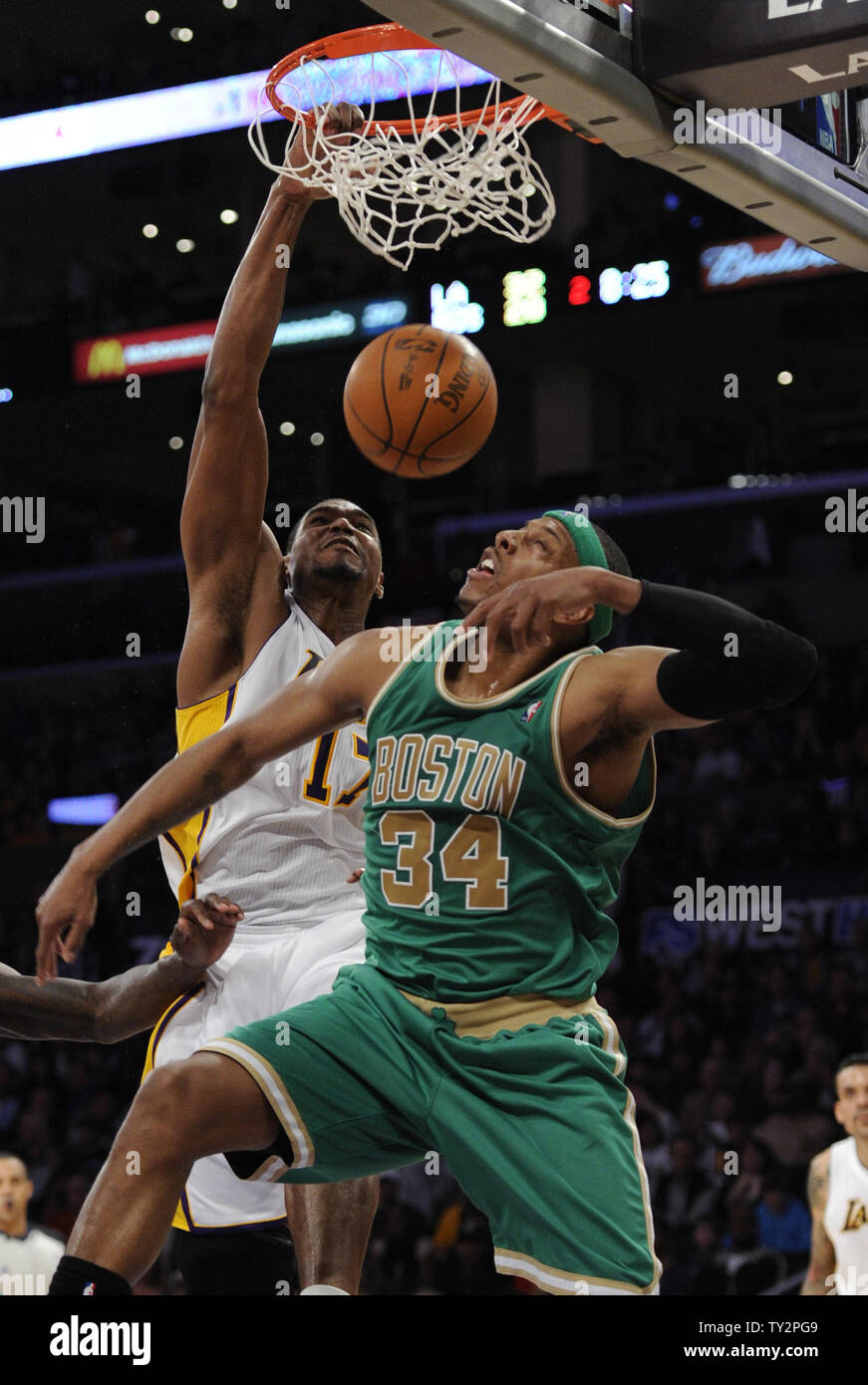 Los Angeles Lakers center Andrew Bynum (17) dunks over Boston Celtics small forward Paul Pierce (34) in the first half of  their NBA basketball game in Los Angeles on March 11, 2012.   UPI/Lori Shepler Stock Photo