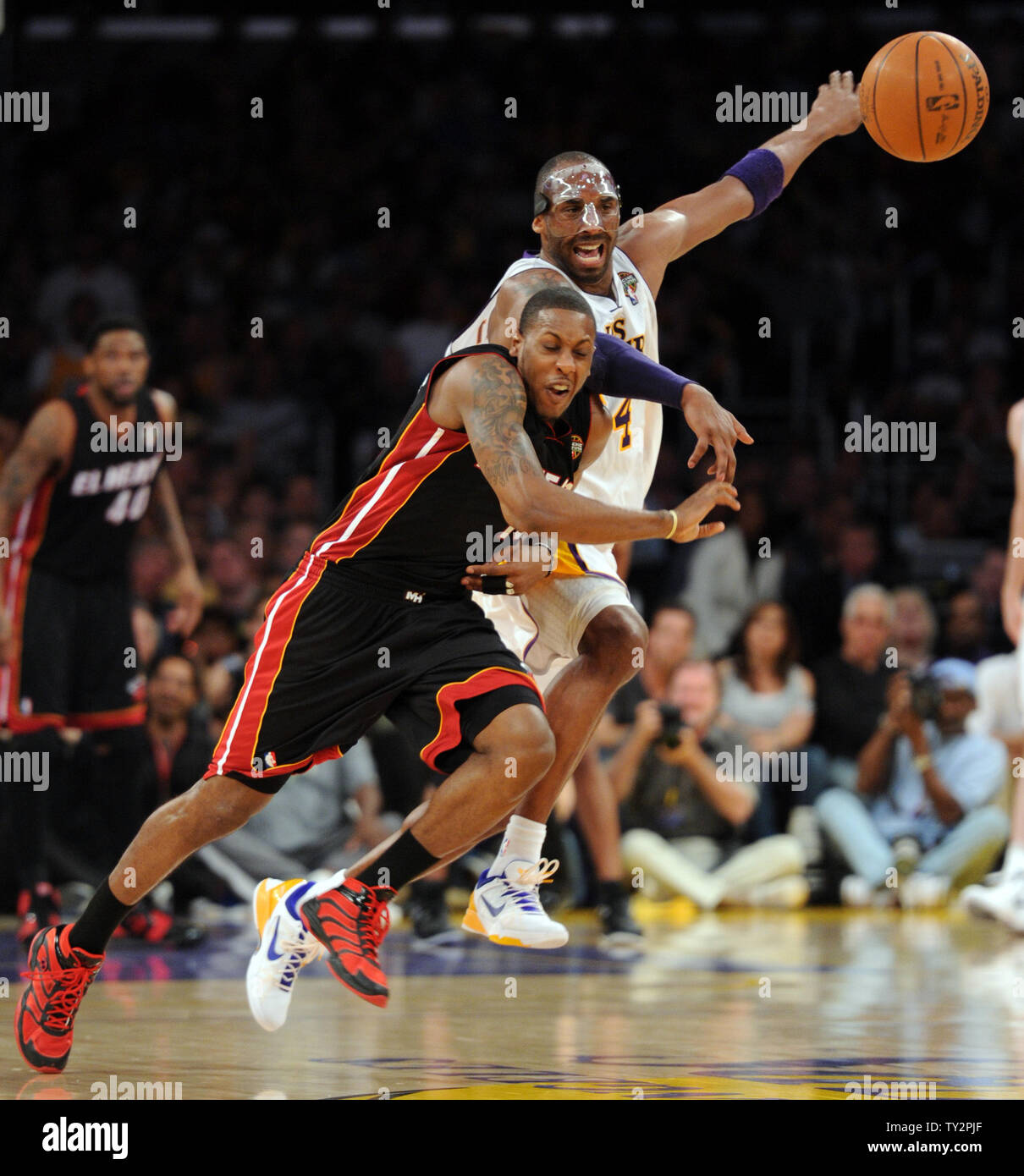 Miami Heat point guard Mario Chalmers (15) steals the ball from Los Angeles Lakers shooting guard Kobe Bryant (24) in the second half of  their NBA basketball game in Los Angeles on March 4, 2012.  The Lakers won 93 to 83.  UPI/Lori Shepler Stock Photo