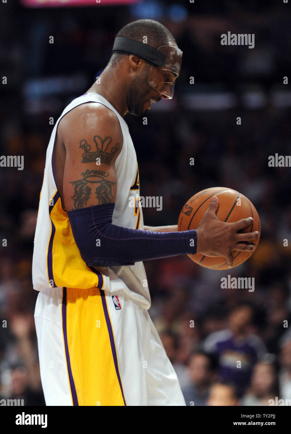 Los Angeles Lakers shooting guard Kobe Bryant (24) reacts after have the ball stolen by Miami Heat point guard Mario Chalmers (15) in the second half of  their NBA basketball game in Los Angeles on March 4, 2012.  The Lakers won 93 to 83.  UPI/Lori Shepler Stock Photo