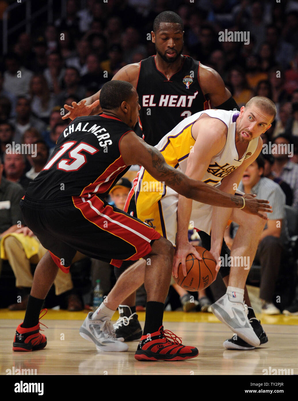 Los Angeles Lakers point guard Steve Blake (5) is trapped by Miami Heat shooting guard Dwyane Wade (3) and Mario Chalmers (15) in the first half of  their NBA basketball game in Los Angeles on March 4, 2012.    UPI/Lori Shepler Stock Photo