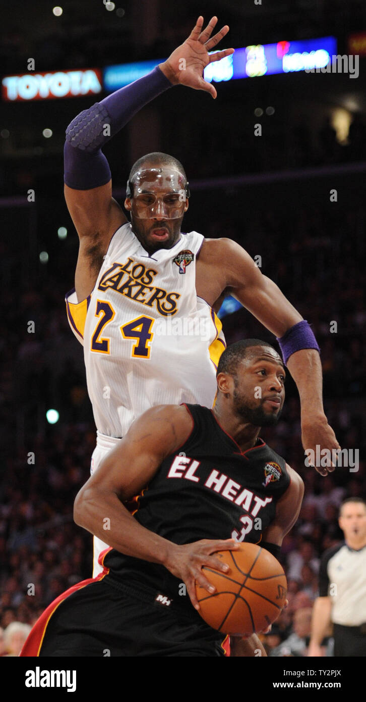 Miami Heat shooting guard Dwyane Wade (3) drives to the basket as Los Angeles Lakers shooting guard Kobe Bryant (24) defends in the second half of  their NBA basketball game in Los Angeles on March 4, 2012.  The Lakers won 93 to 83.  UPI/Lori Shepler Stock Photo