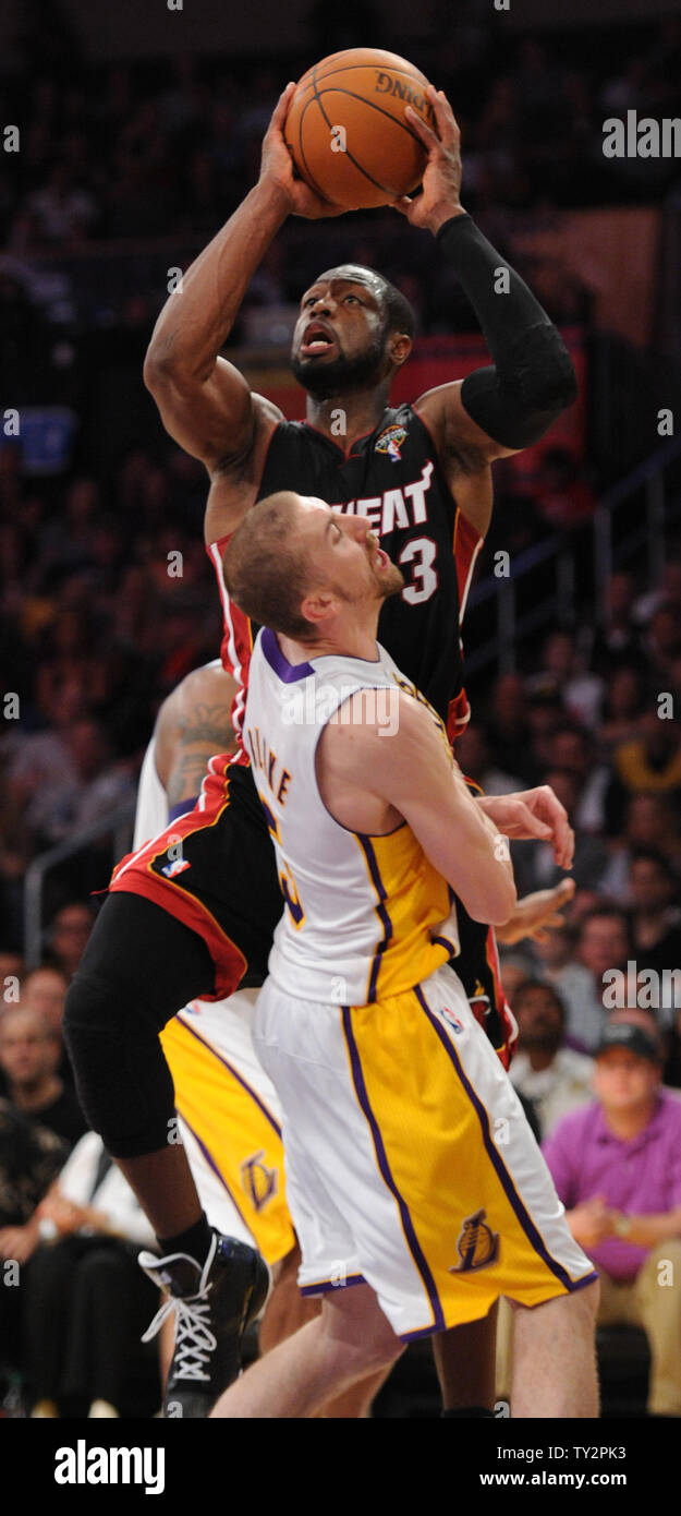 Miami Heat shooting guard Dwyane Wade (3) is called for charging on Los Angeles Lakers point guard Steve Blake (5) in the second half of  their NBA basketball game in Los Angeles on March 4, 2012.  The Lakers won 93 to 83.  UPI/Lori Shepler Stock Photo