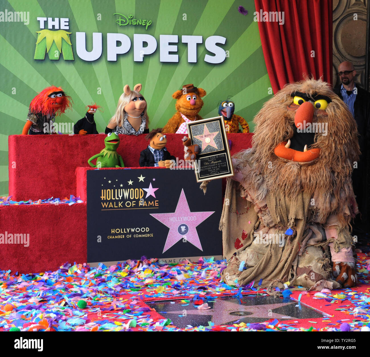 Muppets Animal, Pepe, Miss Piggy, Fozzie, Gonzo, (L-R, rear) and Kermit, Walter and Sweetums (L-R, foreground) attend the Inimitable Muppets unveiling ceremony honoring The Muppets  with the 2,466th star on the Hollywood Walk of Fame in Los Angeles on March 20, 2012. UPI/Jim Ruymen Stock Photo