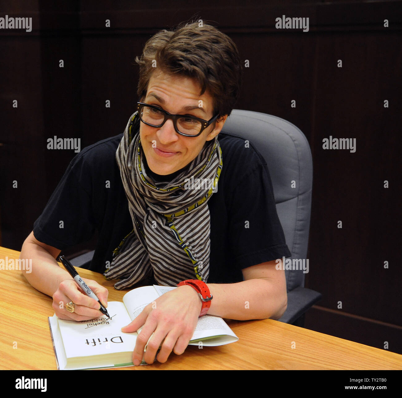 MSNBC political talk show host Rachel Maddow signs copies of her new