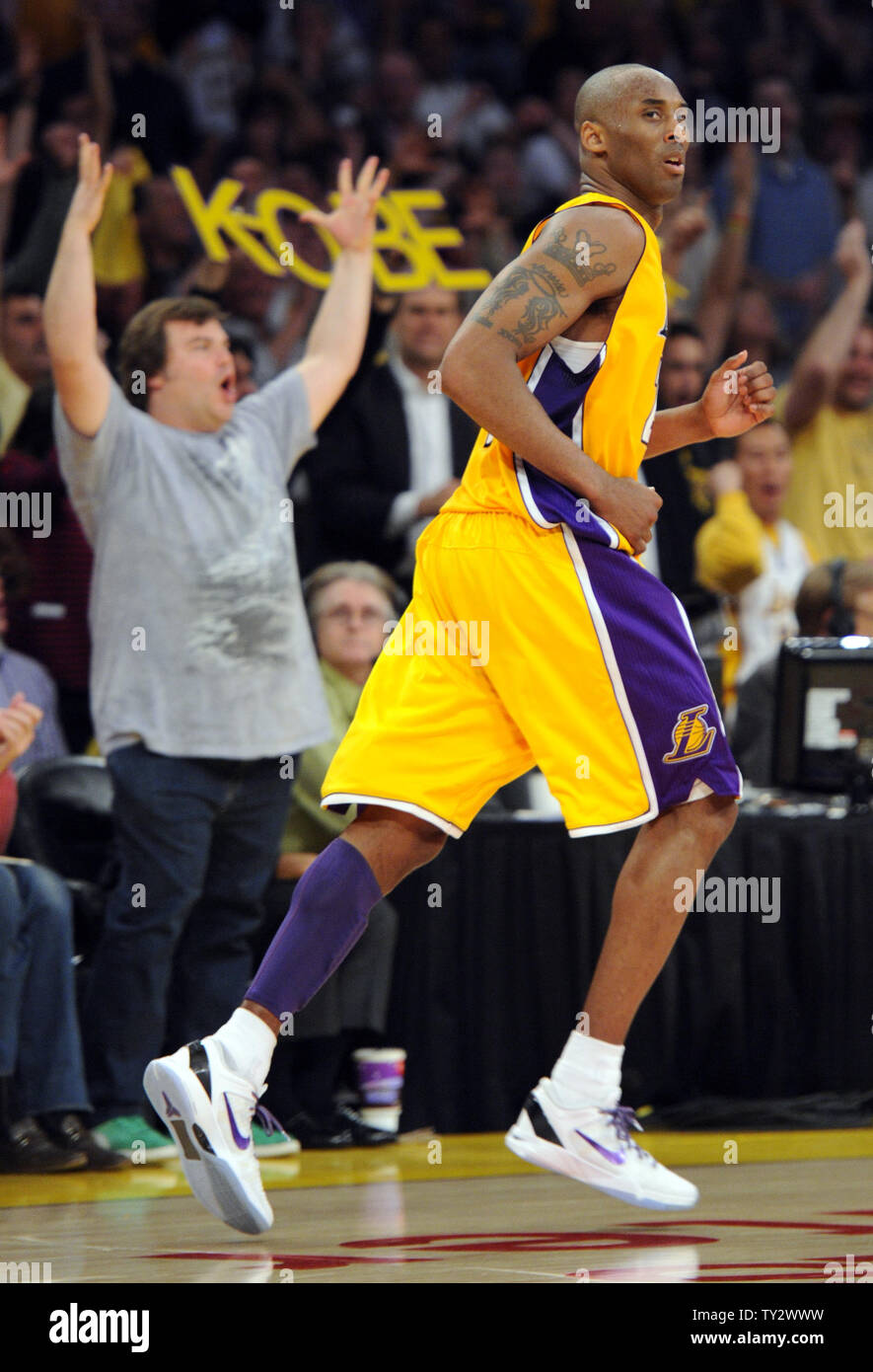 Los Angeles Lakers shooting guard Kobe Bryant (24) makes a 3 point basket during the second half of game 5 of the Western Conference Playoffs against the Denver Nuggets at Staples Center in Los Angeles on May 8, 2012. Actor Jack Black celebrates court side. The Nuggets won 102-99. UPI /Lori Shepler Stock Photo