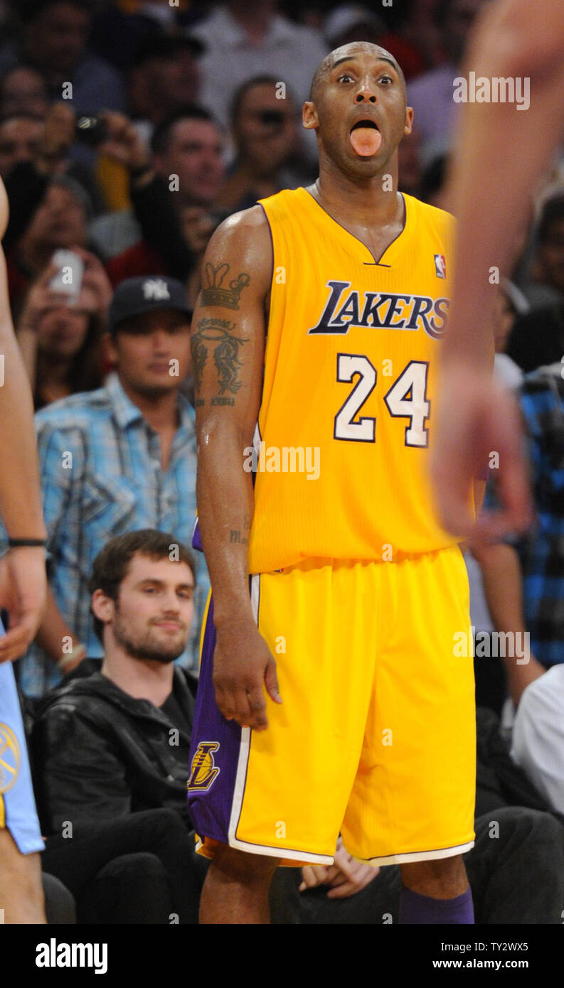 Los Angeles Lakers shooting guard Kobe Bryant (24) signals to a teammate during the second half of game 5 of the Western Conference Playoffs against the Denver Nuggets at Staples Center in Los Angeles on May 8, 2012.  Kevin Love watches court side.The Nuggets won 102-99. UPI /Lori Shepler Stock Photo