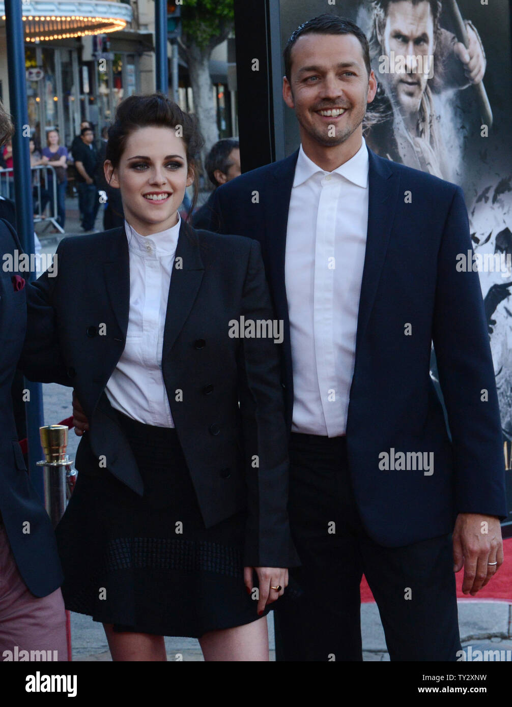 Director Rupert Sanders (R) attends a screening of his new motion picture fantasy 'Snow White and the Huntsman', with cast member Kristen Stewart (L), at the Village Theatre in the Westwood section of Los Angeles on May 29, 2012.  UPI/Jim Ruymen Stock Photo