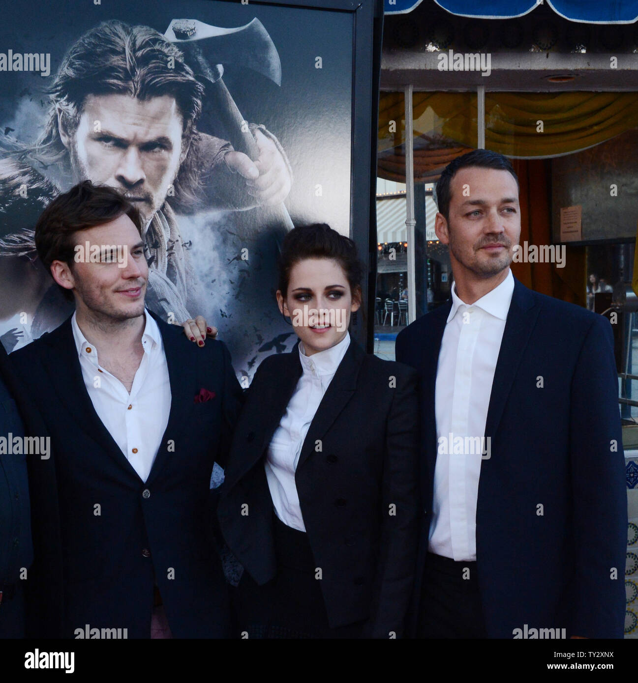Director Rupert Sanders (R) attends a screening of his new motion picture fantasy 'Snow White and the Huntsman', with cast members Sam Caflin (L) and Kristen Stewart (C), at the Village Theatre in the Westwood section of Los Angeles on May 29, 2012.  UPI/Jim Ruymen Stock Photo