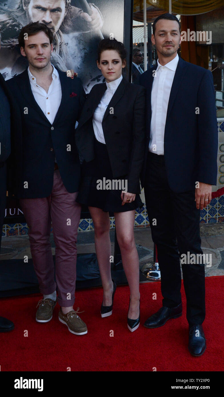 Director Rupert Sanders (R) attends a screening of his new motion picture fantasy 'Snow White and the Huntsman', with cast members Sam Caflin (L) and Kristen Stewart (C), at the Village Theatre in the Westwood section of Los Angeles on May 29, 2012.  UPI/Jim Ruymen Stock Photo