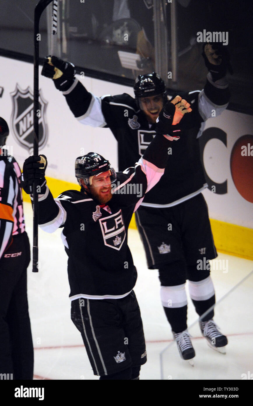 Los Angeles Kings center Jeff Carter 77 celebrates with Anze Kopitar 11 after Carter scored a goal in the second period in game 6 of the NHL Stanley Cup Finals against the