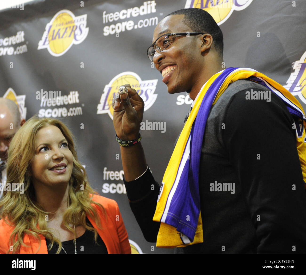 Dwight Howard is introduced as a Los Angeles Laker to the media at a press conference and holds up Jeannie Buss championship ring in Los Angeles on August 10 2012. UPI Lori Shepler