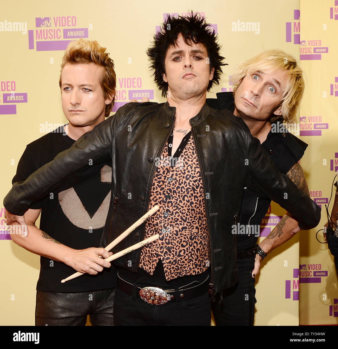 Tre Cool, Billie Joe Armstrong and Mike Dirnt of Green Day arrive for