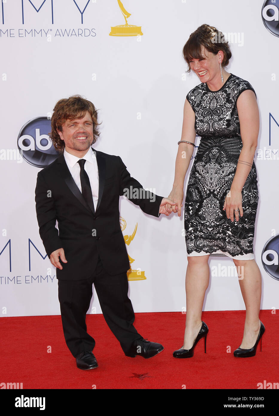 Actor Peter Dinklage and wife Erica Schmidt arrive at the 64th Primetime Emmy Awards at the Nokia Theatre in Los Angeles on September 23, 2012.   UPI/Danny Moloshok Stock Photo