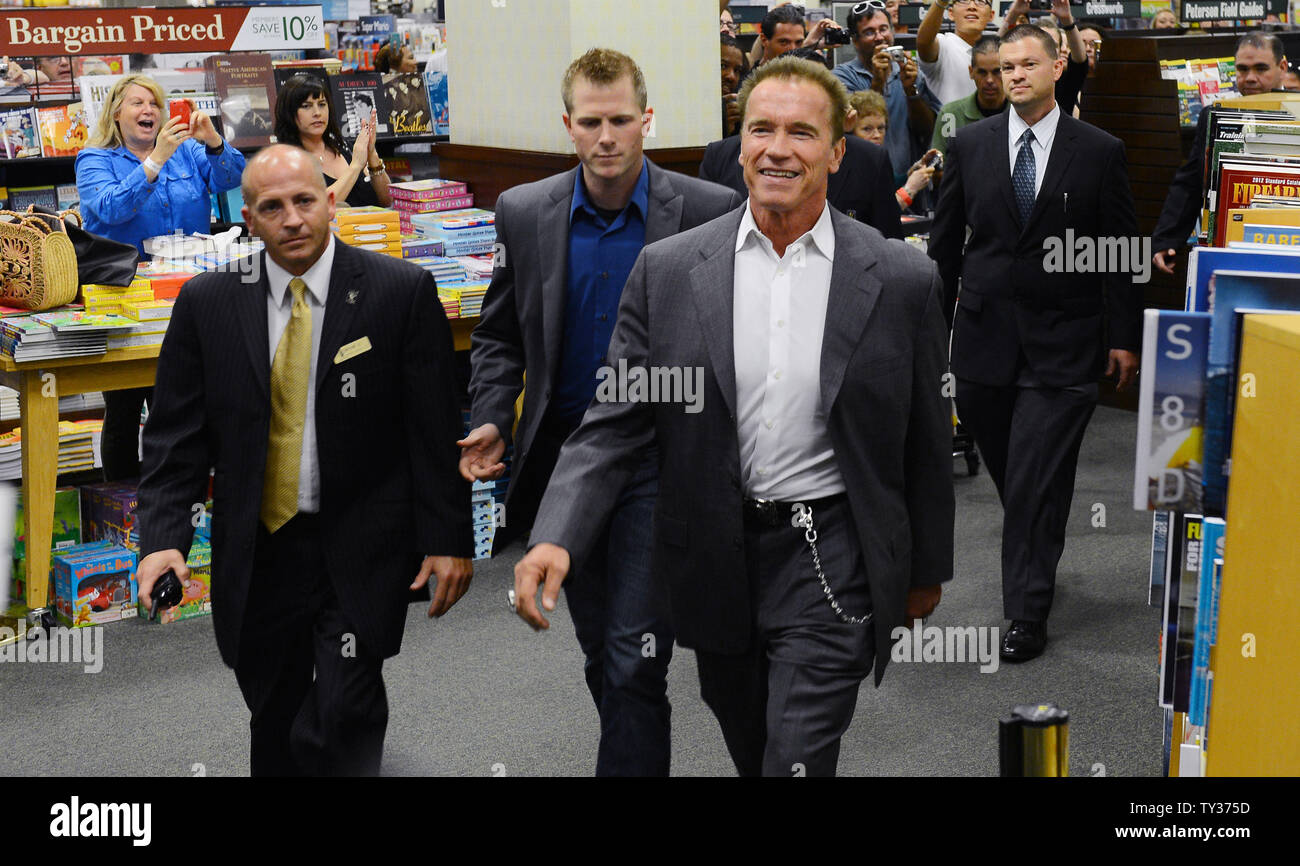 Arnold Schwarzenegger arrives to sign copies of his new book "Total